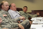 Gen. Charles Jacoby, Jr. (left), commanding general, North American Aerospace Defense Command and U.S. Northern Command, Robert Fenton Jr. (center), assistant administrator, Federal Emergency Management Agency, and Lt. Gen. William Caldwell IV, commanding general, U.S. Army North (Fifty Army) discuss the importance of preparation for any eventuality during the Complex Catastrophe Tabletop Exercise held June 5 at Army North in the historic Quadrangle. 

