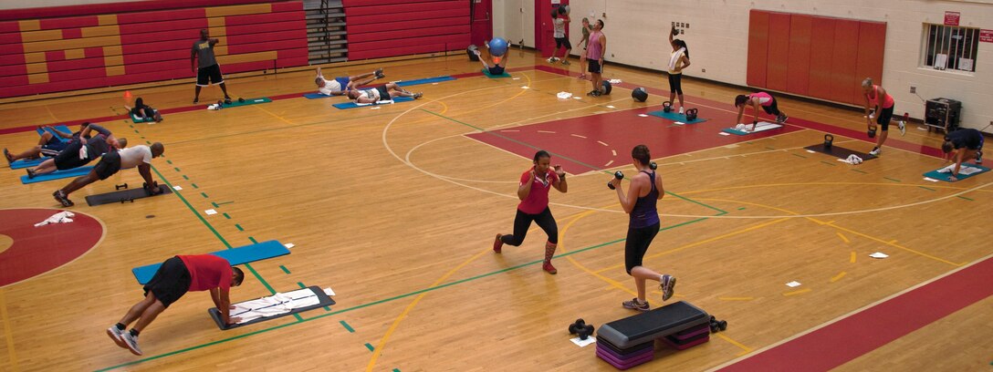 Class participants hop, lift, and push themselves through exercises during the High Intensity Circuit training class at the Semper Fit Center gym, July 9, 2013. (U.S. Marine Corps photo by Lance Cpl. Janelle Y. Chapman)