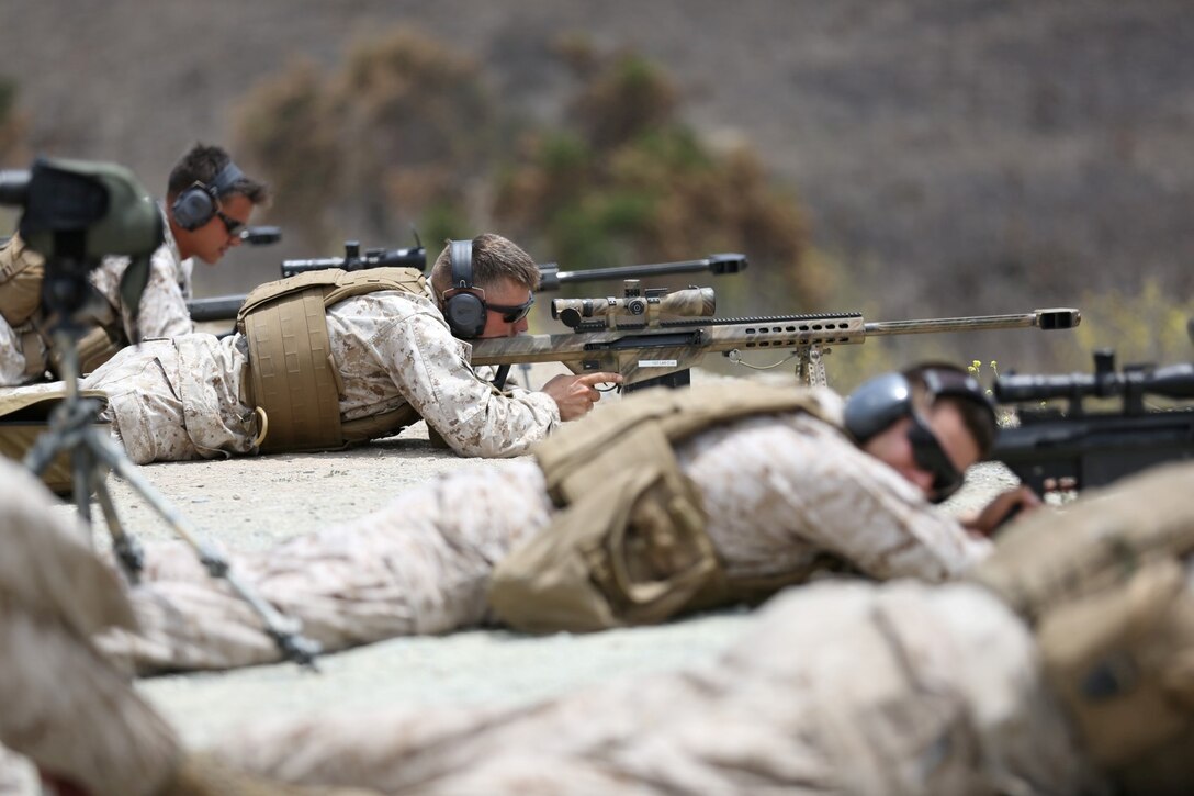 Sergeant Michael Henderson, chief scout serving with Charlie company, 1st Light Armored Reconnaissance Battalion, fires an M107 Special Application Scoped Rifle during a weeklong SASR training course here, July 10, 2013. Henderson, a native of Kalamazoo, Mich., took the course to learn how to effectively use the .50 caliber rifle and to train his Marines in his company.