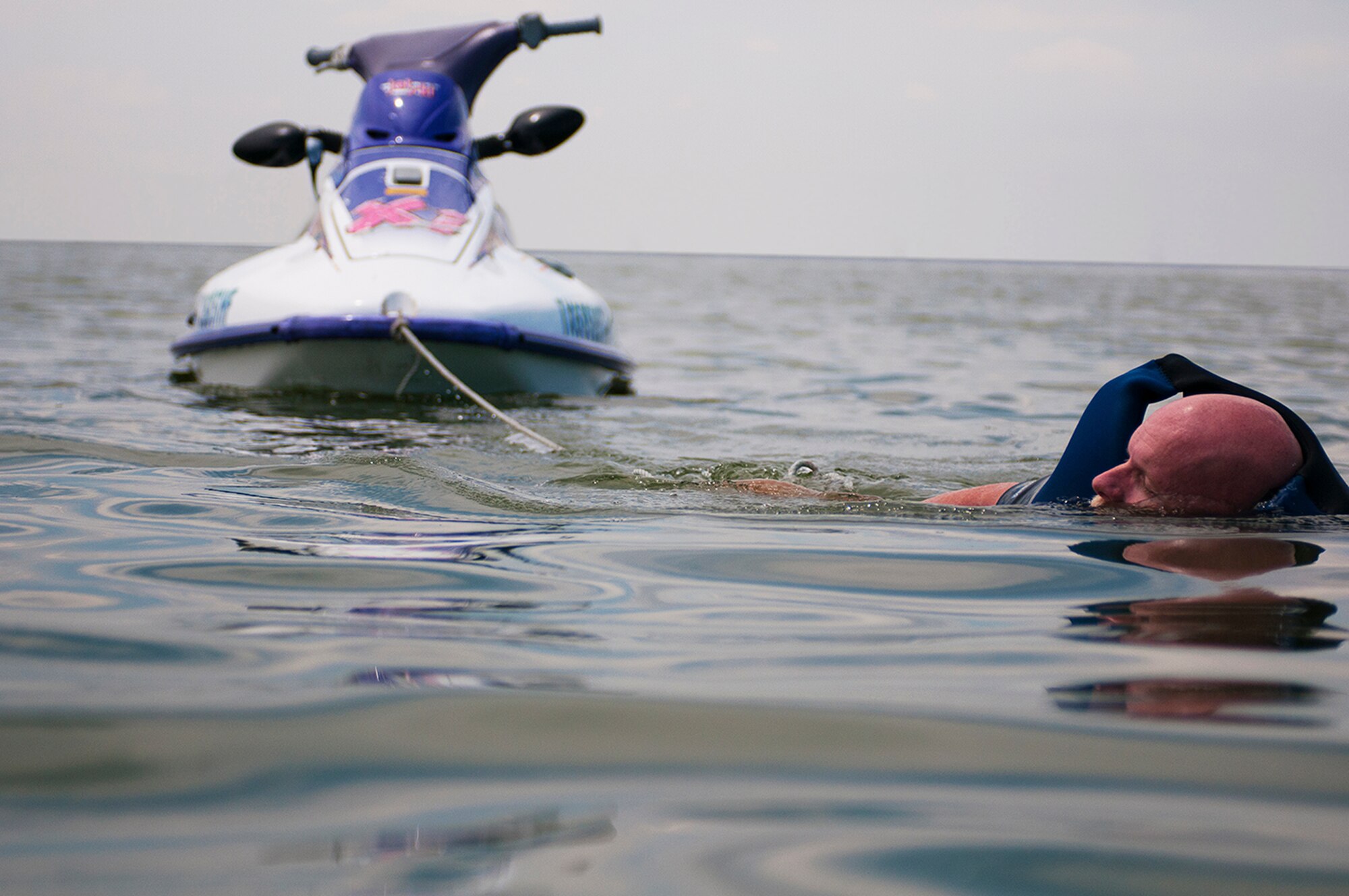 Miles from shore, Robert Spence had to make it to land by swimming — with his broken jet ski in tow. (U.S. Air photo by Tech. Sgt. Sarayuth Pinthong/Released)