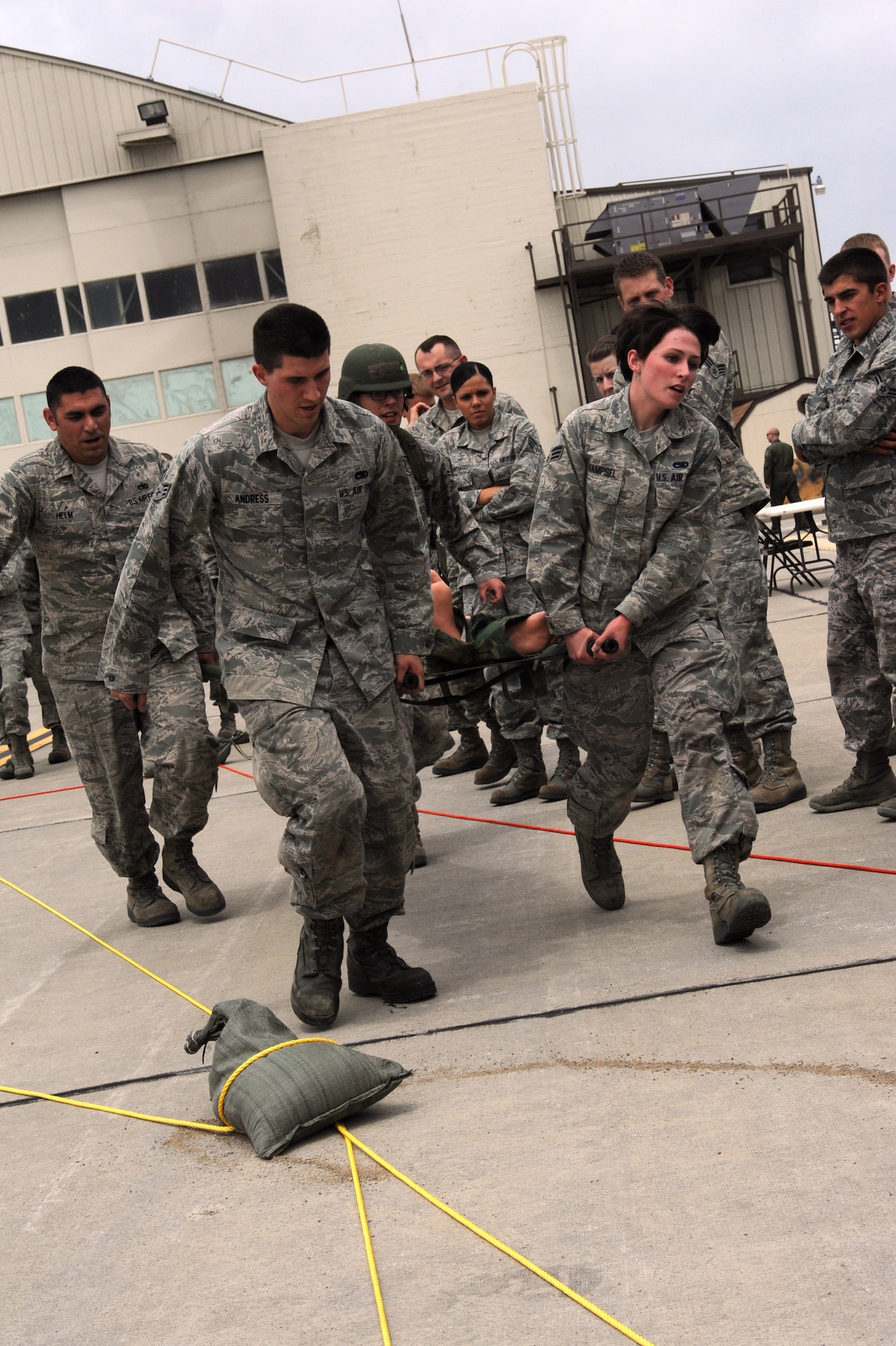 A team rushes through an obstacle course during the Gunfighter Challenge July 11, 2013, at Mountain Home Air Force Base, Idaho. The goal was the same as the other events, finish in record time and beat the other team. (U.S. Air Force photo by Senior Airman Benjamin Sutton/ Released)