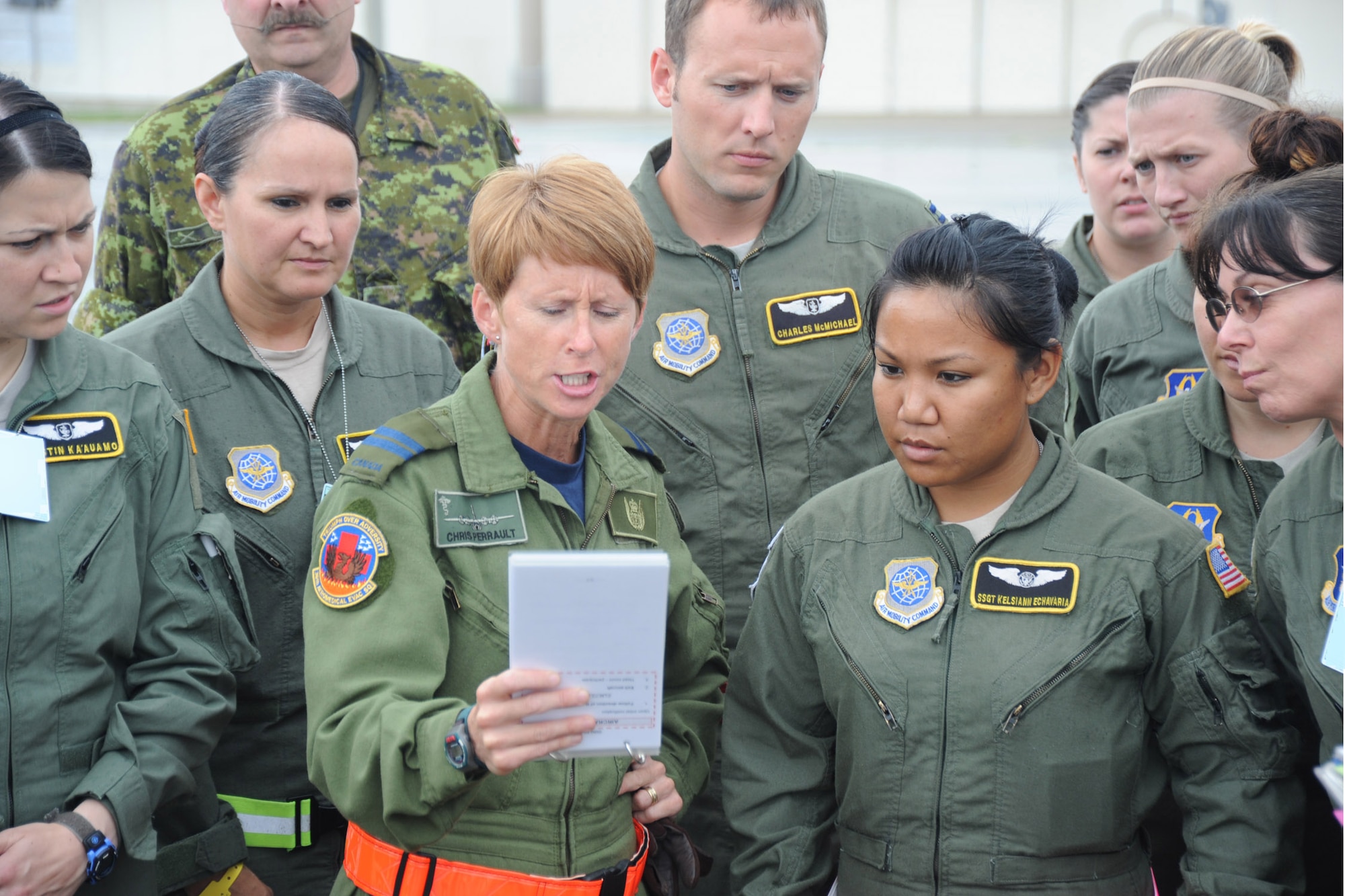 Capt. Chris Perrault, a flight nurse with the Royal Canadian Air Force 426th Squadron Medical Flight, reads from the pre-flight checklist before a training mission with American 36th Aeromedical Evacuation Squadron and 43rd AES at Pope Field, N.C., on July 12, 2013.  The American and Canadian flight crews and medical crews joined forces to enhance inter-service interoperability and provide continuation training, said RCAF Warrant Officer James Oddie, the 426th flight warrant officer.  (Air Force Photo by Tech. Sgt. Peter R. Miller)