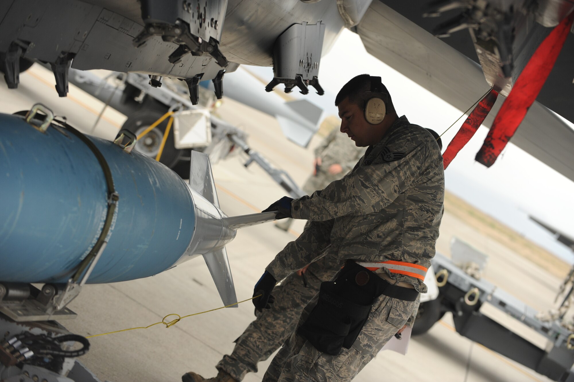 Staff Sgt. Joel Grout, 366th Aircraft Maintenance Squadron crew chief, participates in a load competition as part of the Gunfighter Challenge at Mountain Home Air Force Base, Idaho, July 11, 2013. The Gunfighter Challenge consists of different events with two teams competing against each other. (U.S. Air Force photo by Airman 1st Class Malissa Lott/Released)