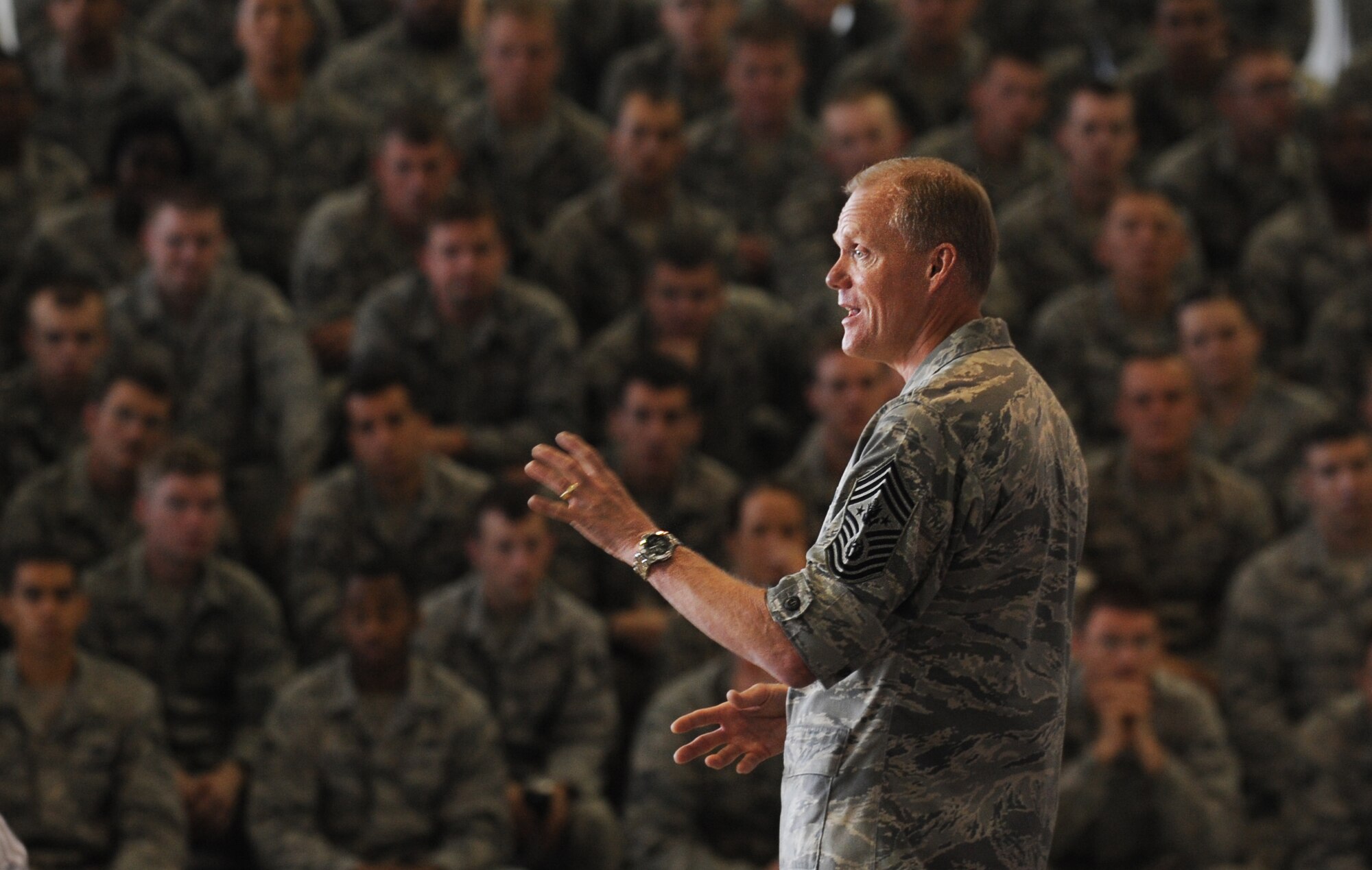 Chief Master Sgt. of the Air Force, James Cody addresses the Airmen of Minot Air Force Base, N.D., at an all call event July 12, 2013. Airmen were able to ask questions regarding the topics foremost on their minds and the event was also streaming live to those deployed to the missile complex. (U.S. Air Force photo/ Airman 1st Class Stephanie Ashley)
