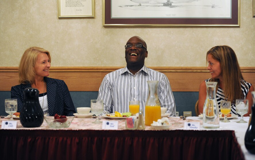 Athena Cody, spouse of Chief Master Sgt. of the Air Force, James Cody enjoys a meal with the Key Spouses and Enlisted Spouses groups at Minot Air Force Base, N.D., July 12, 2013. Mrs. Cody toured a variety of base facilities during her visit and took note of the issues faced by spouses and their families on a daily basis. (U.S. Air Force photo/ Airman 1st Class Stephanie Ashley)