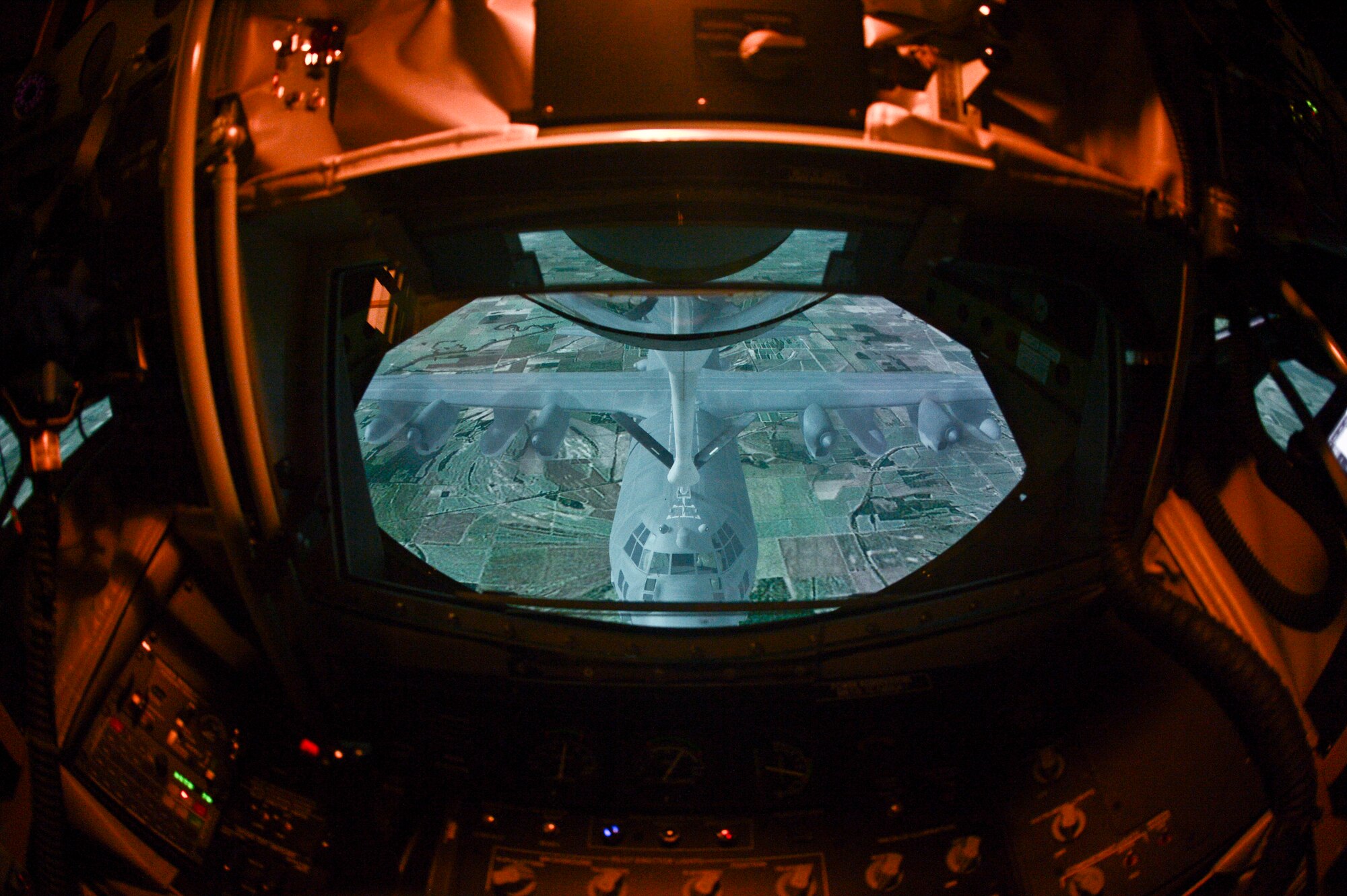 Pictured is the viewpoint from a boom operator’s perspective as they train in a KC-135 Stratotanker Boom Operator Weapon System Trainer. The BOWST is a fully-simulated, large-scale procedural trainer for aerial refueling with replicated aircraft systems, controls, and functions within a complete aircrew boom compartment. (U.S. Air Force Photo by Staff Sgt. Brandon Shapiro/Released)  