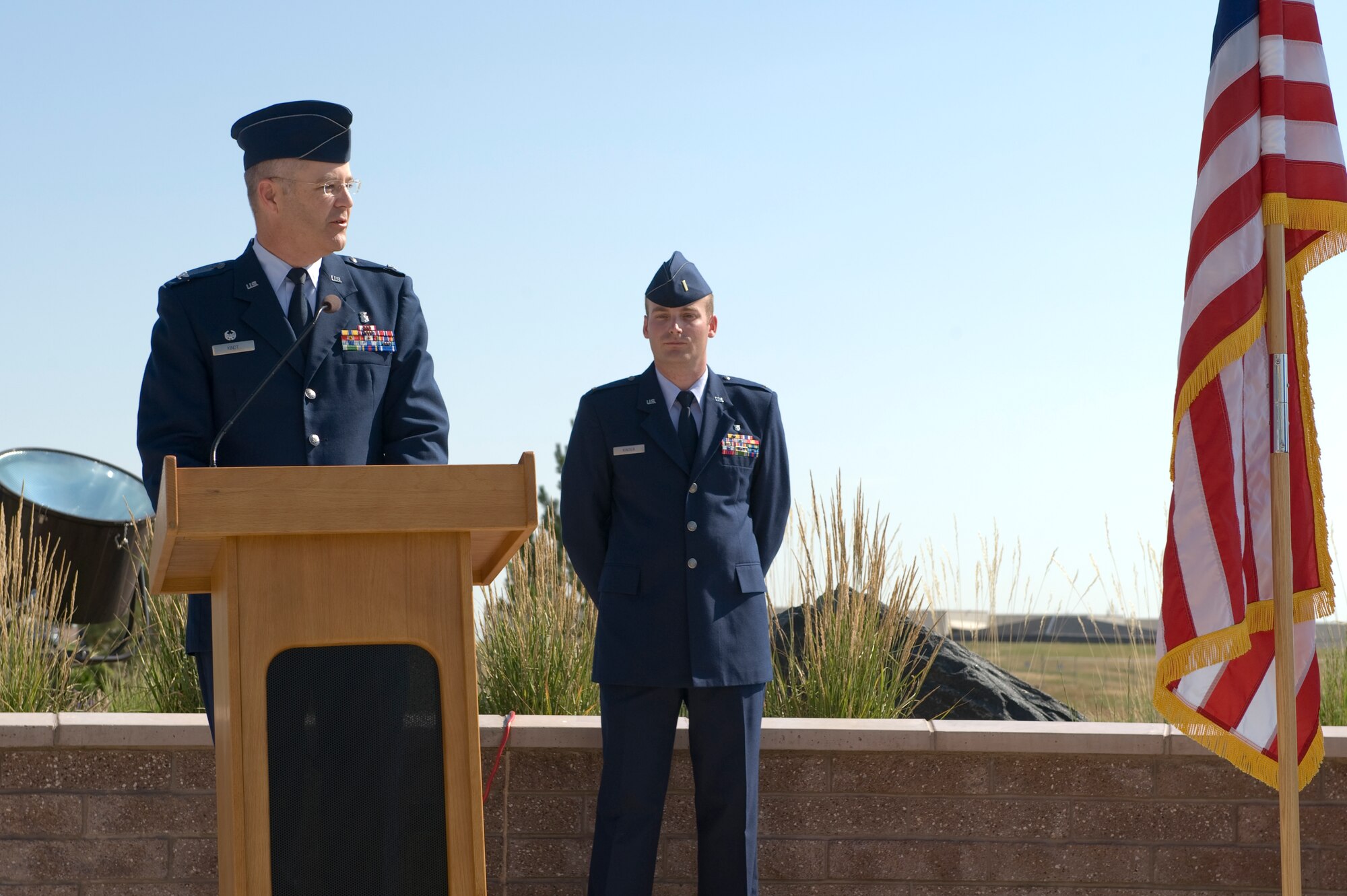 Col. Michael Kindt, 460th Medial Group commander, addresses members of the 460th MDG July 11, 2013, on Buckley Air Force Base, Colo. Kindt will command a group that supports world-wide contingency operations with space operations components and delivers medical support for 3,600 active-duty and 3,400 family members. (U.S. Air Force photo by Senior Airman Phillip Houk/Released)