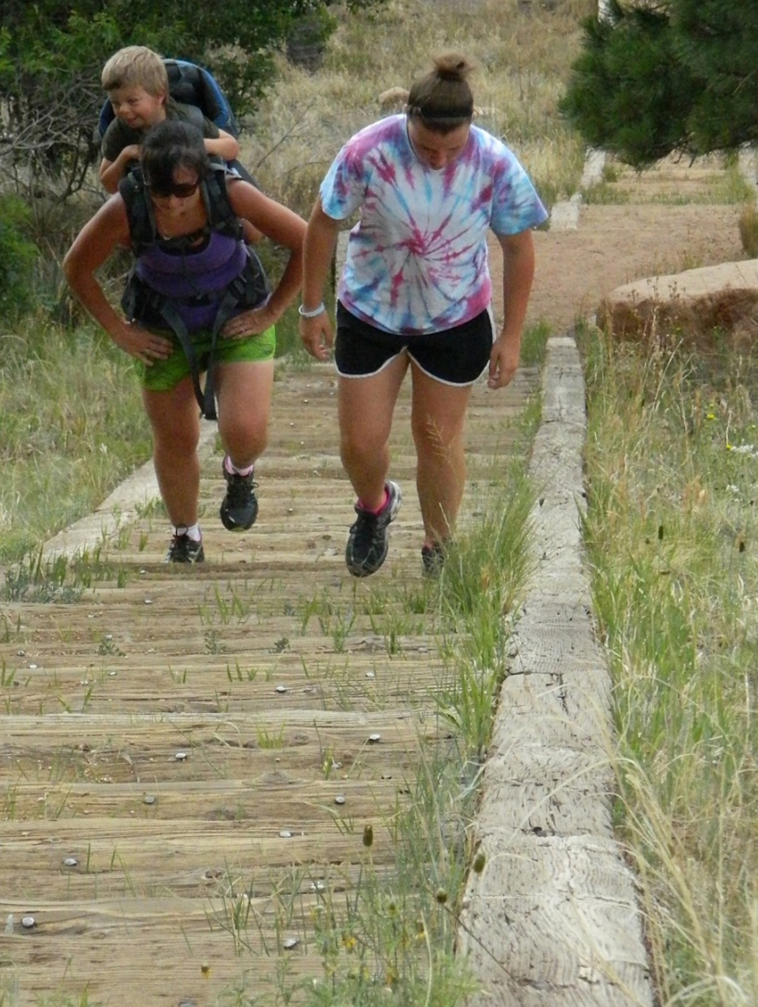 Renee and Anika Soerensen climb the Stairway to Heaven for round two of their workout up and down the 300-plus steps. Both mother and daughter train on the stairway regularly to condition for the Manitou Incline and hunting season. (U.S. Air Force photo/Amber Baillie)