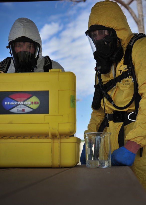 Team members conduct a series of tests during the HAZMAT Responder Olympics July 12, 2013, at Cannon Air Force Base, N.M. The joint training competition pulled participants from Bioenvironmental Engineering, Emergency Management and Fire Protection and challenged them in several scenarios covering Chemical, Biological, Radiological and Nuclear incidents. (U.S. Air Force photo/Senior Airman Alexxis Pons Abascal) 