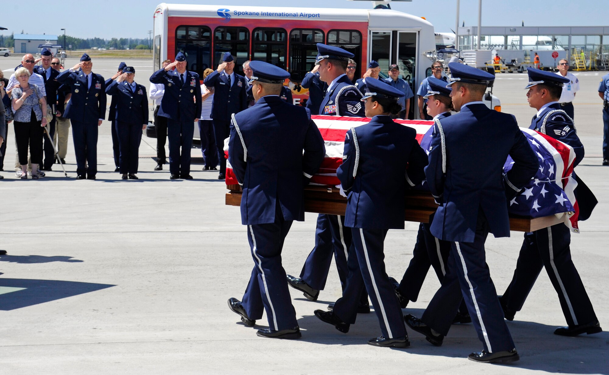Fairchild’s Honor Guard carries the remains of Maj. Larry Hanley at the Spokane International Airport in Spokane, Wash., July 11, 2013. Hanley was piloting an F-105D Thunderchief that crashed in Khammouan Province, Laos, while he was attacking an enemy antiaircraft position during the Vietnam War in 1969. (U.S. Air Force photo by Airman 1st Class Ryan Zeski/Released)