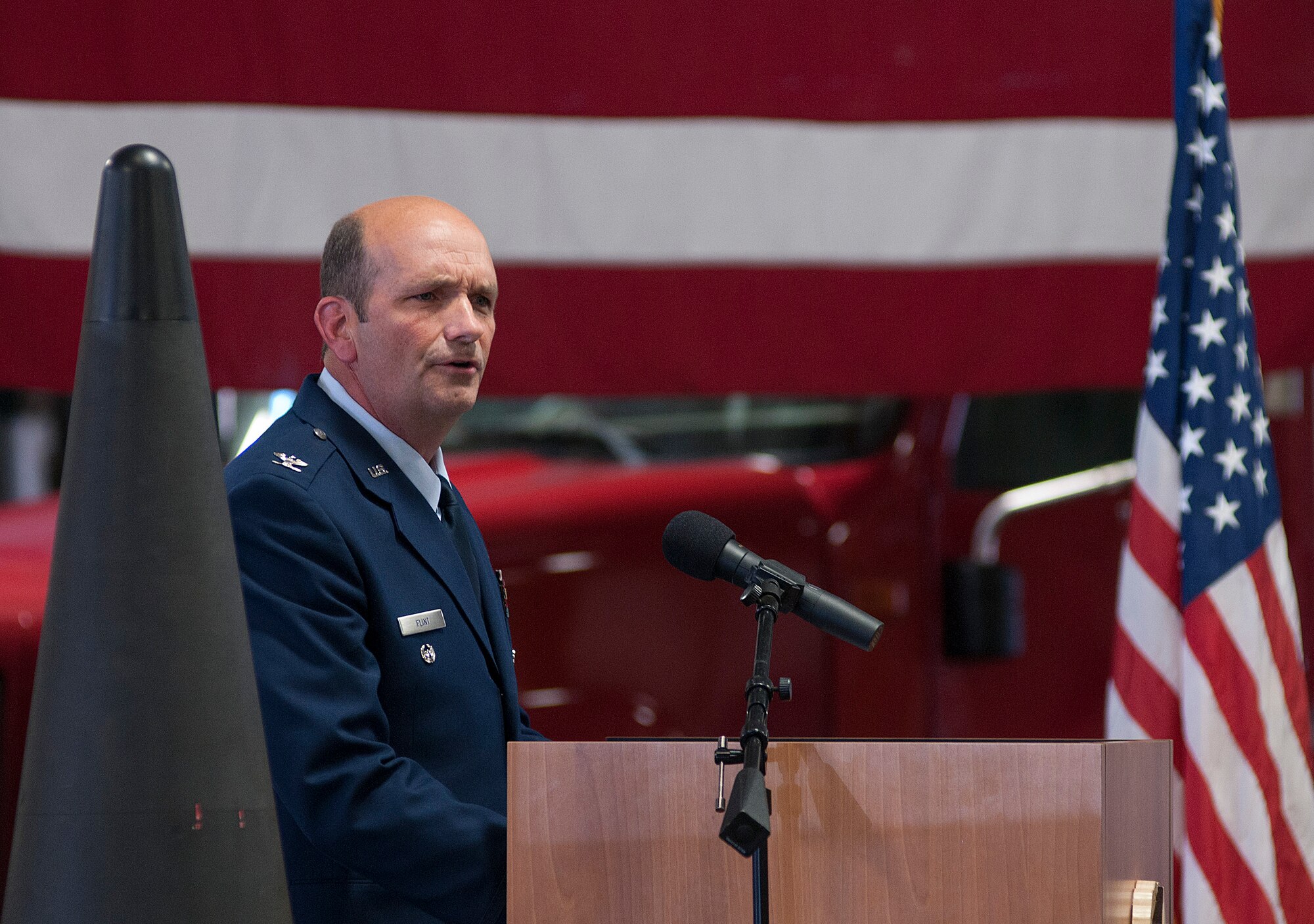 Col. Trevor Flint, 90th Maintenance Group commander, addresses his Airmen and guests during the 90th MXG change of command July 3, 2013. (U.S. Air Force photo by R.J. Oriez)