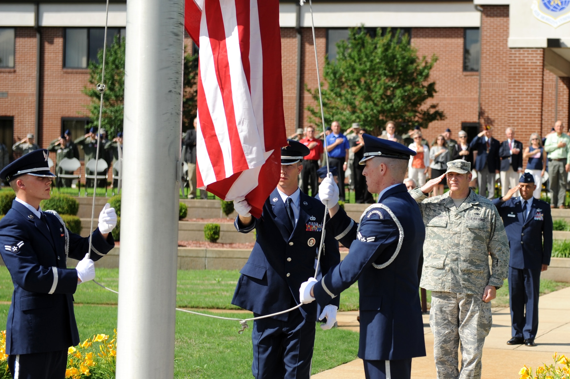 Base honor guardsmen retrieve the American Flag during the base's Memorial Day retreat ceremony May 23, 2013, at Little Rock Air Force Base, Ark. The Memorial Day Retreat Ceremony is just one of many events that the honor guard supports on base. (U.S. Air Force photo by Senior Airman Rusty Frank)