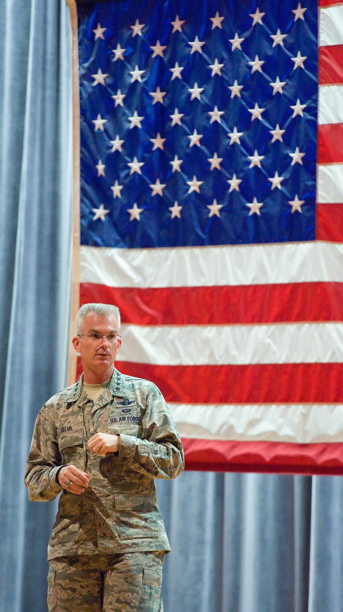 Gen. Paul Selva, Air Mobility Command commander, speaks to military and civilian personnel July 10, 2013, at the base theater on Dover Air Force Base, Del. During the all call, Selva answered a wide variety of furlough, budget, training and manpower questions from base personnel. (U.S. Air Force photo/Roland Balik)