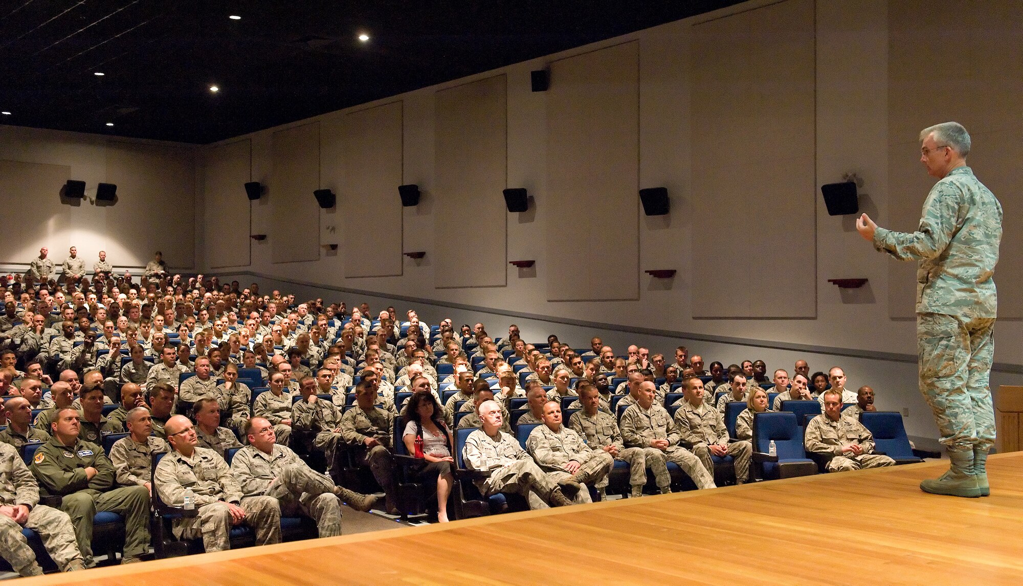 Gen. Paul Selva, Air Mobility Command commander, speaks to military and civilian personnel July 10, 2013, at the base theater on Dover Air Force Base, Del. During the all call, Selva answered a wide variety of furlough, budget, training and manpower questions from base personnel. (U.S. Air Force photo/Roland Balik)