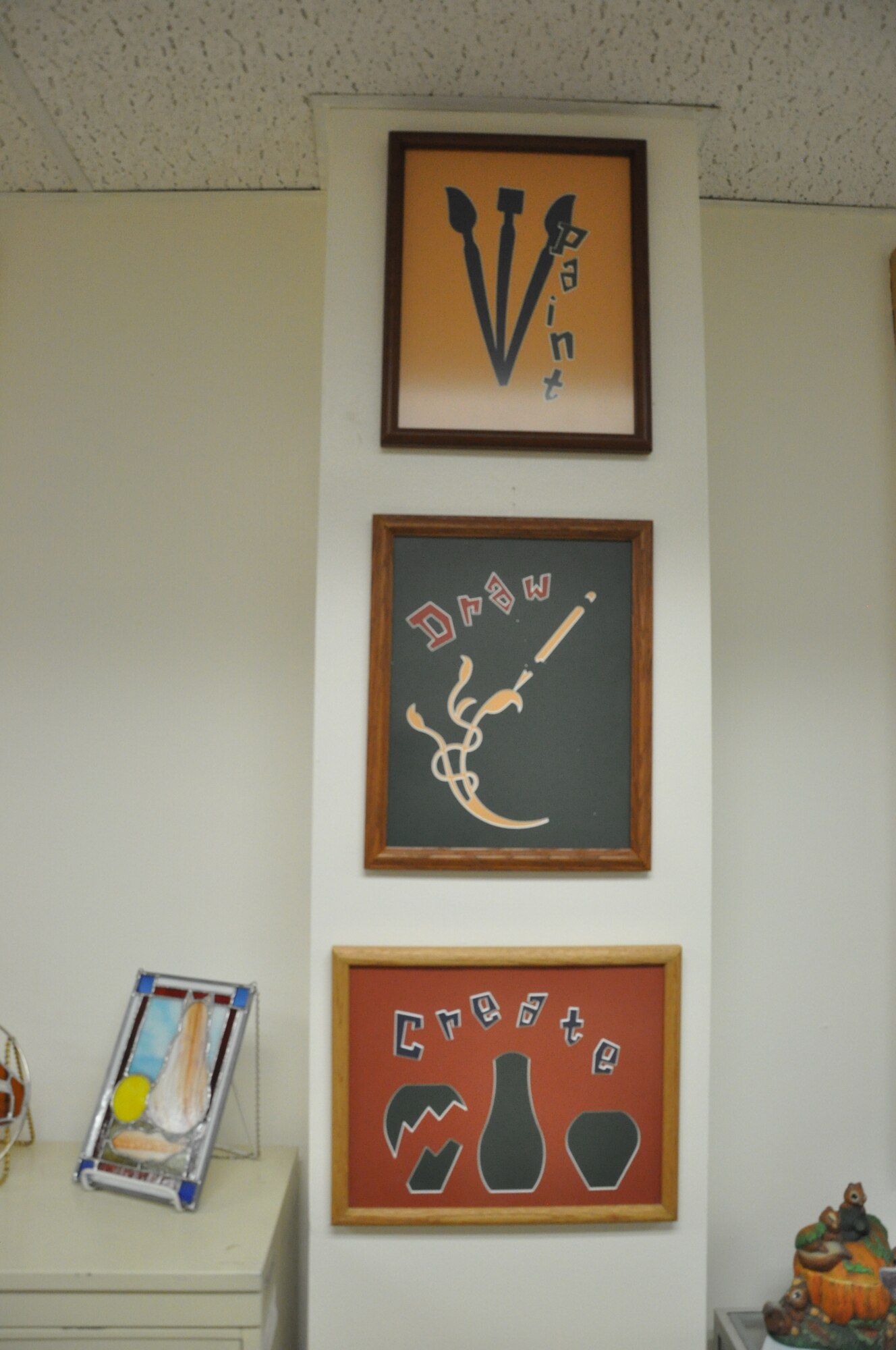 Signs in the Arts & Crafts Center’s multi-craft room advertising some activities to available. (U.S. Air Force by Airman 1st Class Brandon Valle)