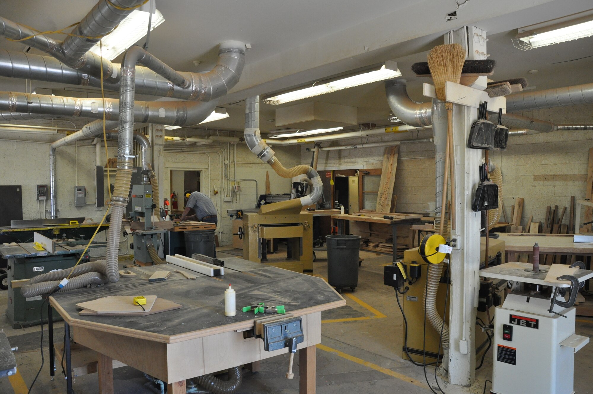 The wood shop in the Arts & Crafts Center provides many pieces of machinery for wood work of all types. For a small fee, anyone who undergoes the Arts & Crafts Center’s safety training can utilize the machines for custom projects. (U.S. Air Force by Airman 1st Class Brandon Valle)