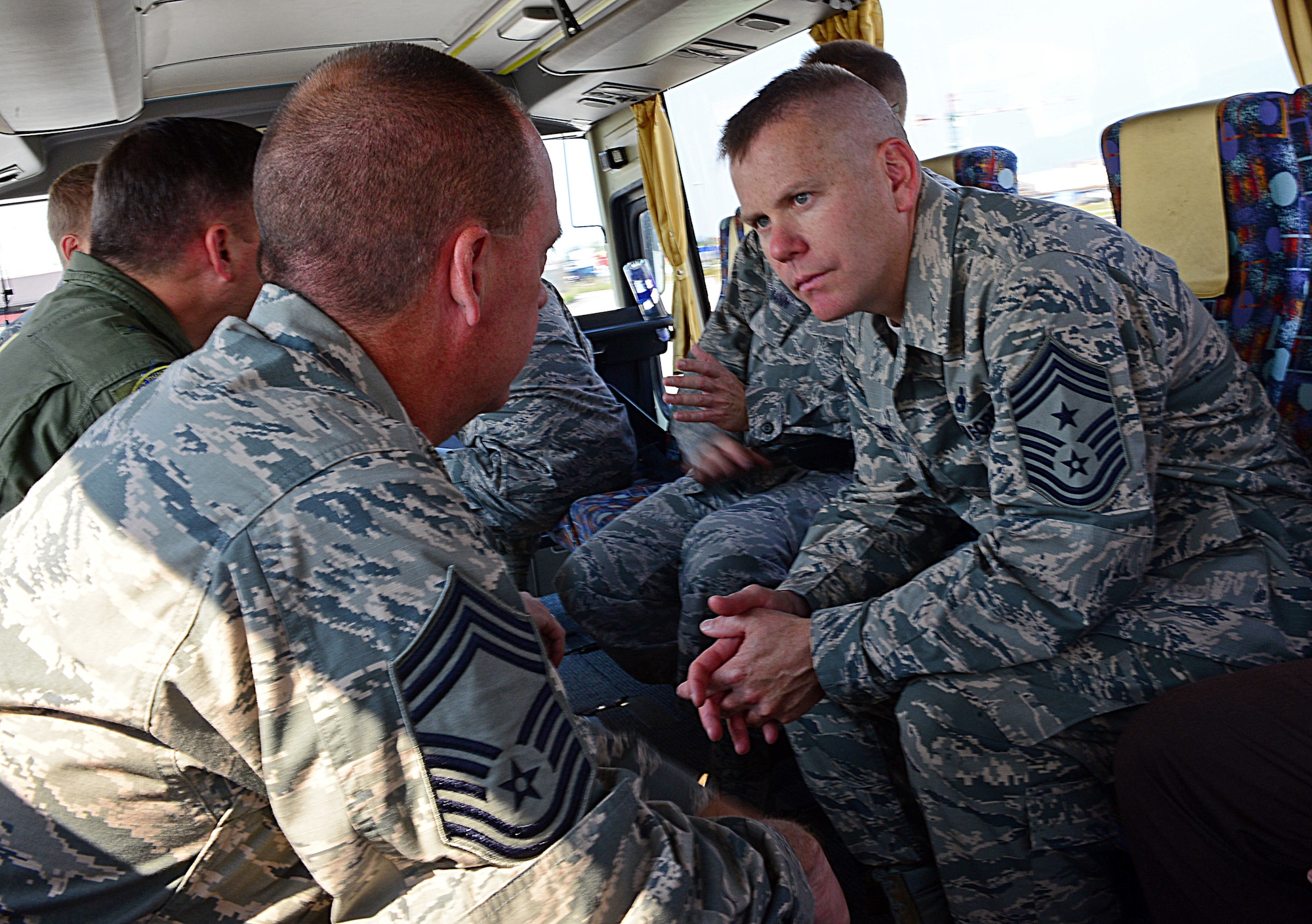 (From left) Chief Master Sgt. Todd Folks, 31st Maintenance Group superintendent, talks with Chief Master Sgt. Mark Batzer, right, 31st Fighter Wing command chief,  July 2, 2013, at Aviano Air Base, Italy. As the wing's senior enlisted leader with 28 years of service, Batzer provides guidance and support to Airmen of all ranks to include junior, NCO and senior NCO enlisted members across Aviano. (U.S. Air Force photo/Airman 1st Class Matthew Lotz)