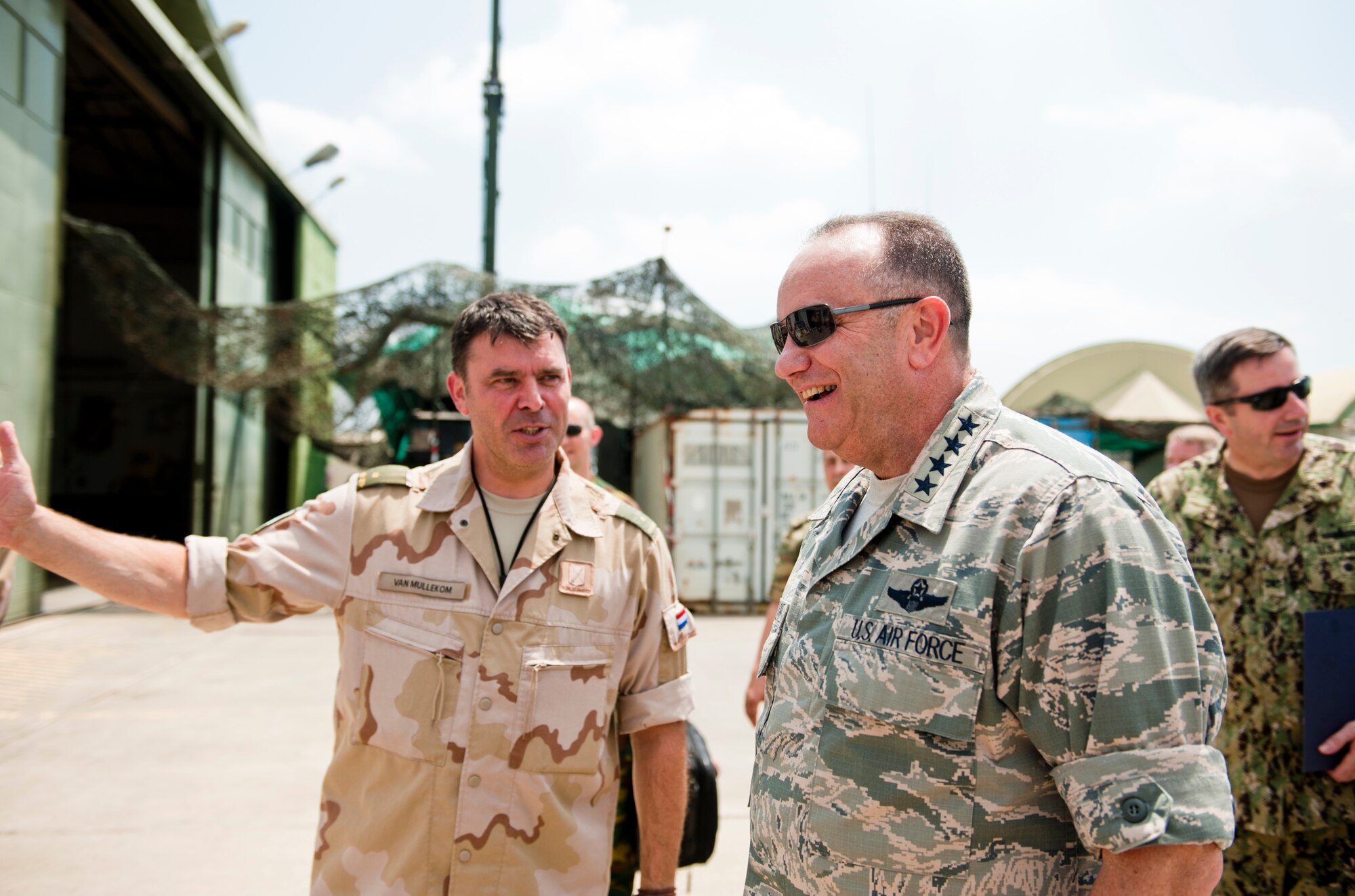 A Dutch soldier directs U.S. Air Force Gen. Philip Breedlove, NATO Supreme Allied Commander Europe, to the Dutch Patriot Missile command site July 11, 2013, at Incirlik Air Base, Turkey. Breedlove visited the Dutch Patriot Missile sites during his SACEUR immersion tour at Incirlik AB. (U.S Air Force photo by Senior Airman Daniel Phelps/Released)