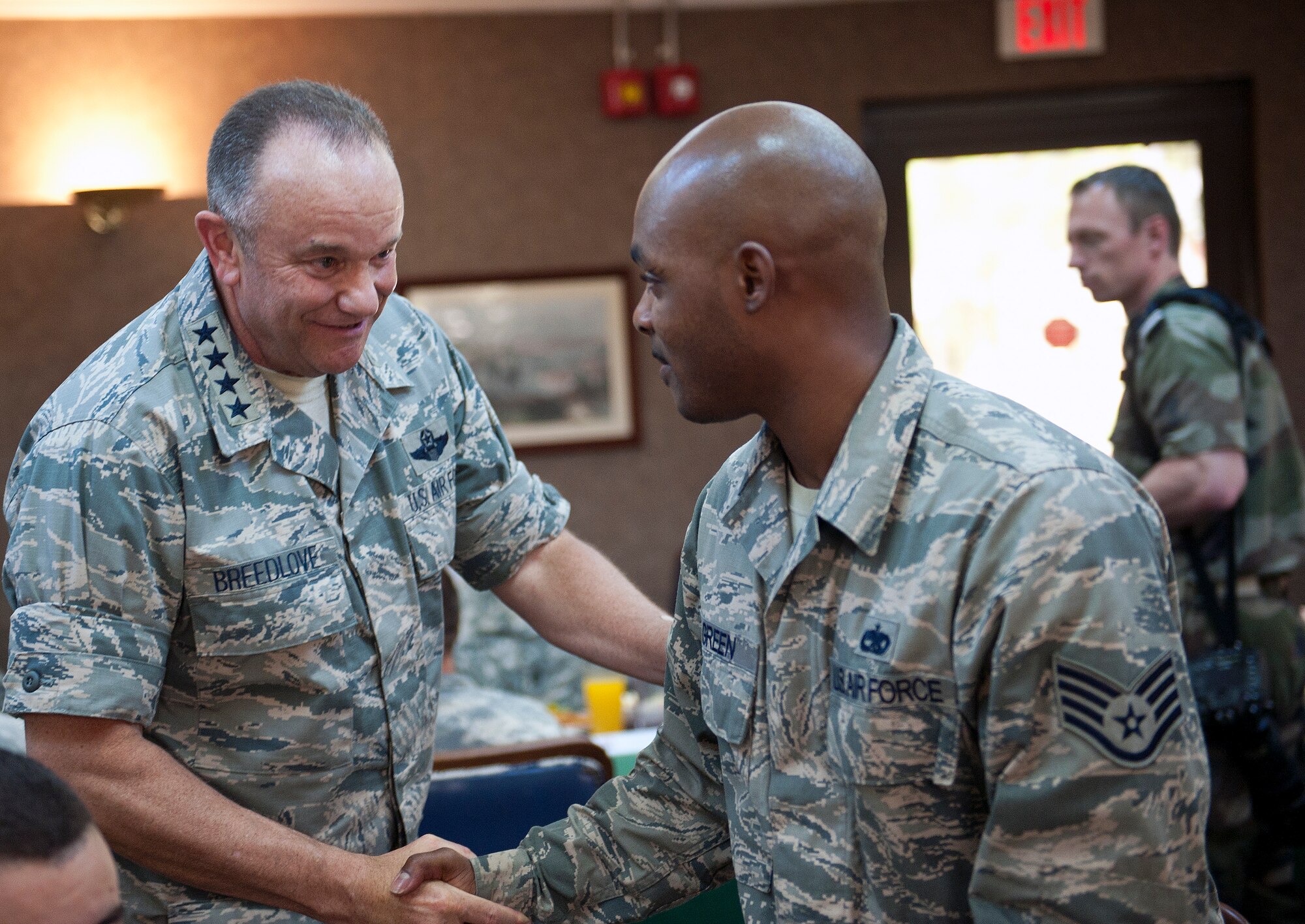U.S. Air Force Gen. Philip Breedlove, NATO Supreme Allied Commander Europe, introduces himself to U.S. Air Force Staff Sgt. Regis Green, 39th Maintenance Squadron quality assurance, during a luncheon July 11, 2013, at Incirlik Air Base, Turkey. Breedlove had a luncheon with U.S. forces and NATO allies during his visit to Incirlik AB. (U.S. Air Force photo by Senior Airman Daniel Phelps/Released)