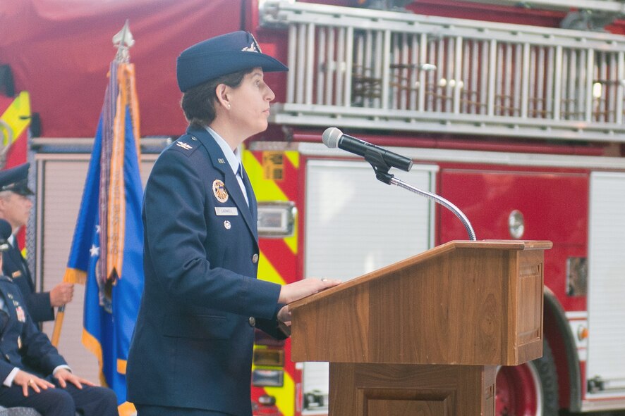 RAF ALCONBURY, United Kingdom - Col. Angela Cadwell addresses members of the 501st Combat Support Wing after assuming command of the wing during a change of command ceremony at the RAF Alconbury Fire Department July 12. (U.S. Air Force photo by Staff Sgt. Brian Stives)