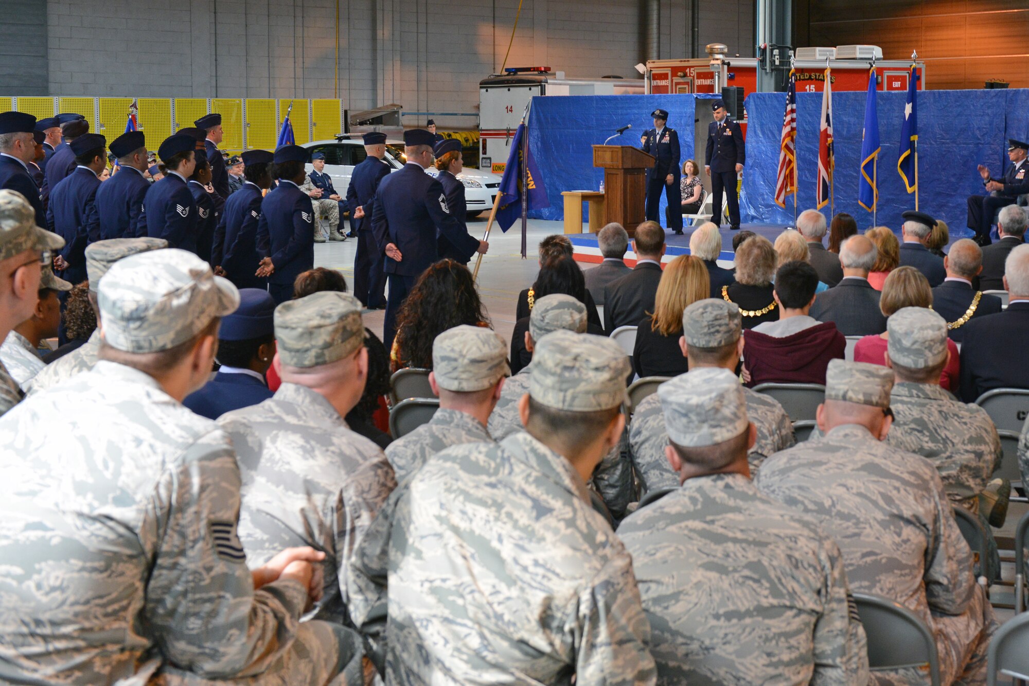RAF ALCONBURY, United Kingdom - Col. Angela Cadwell addresses members of the 501st Combat Support Wing after assuming command of the wing during a change of command ceremony at the RAF Alconbury Fire Department July 12. (U.S. Air Force photo by Tech. Sgt. Chrissy Best)