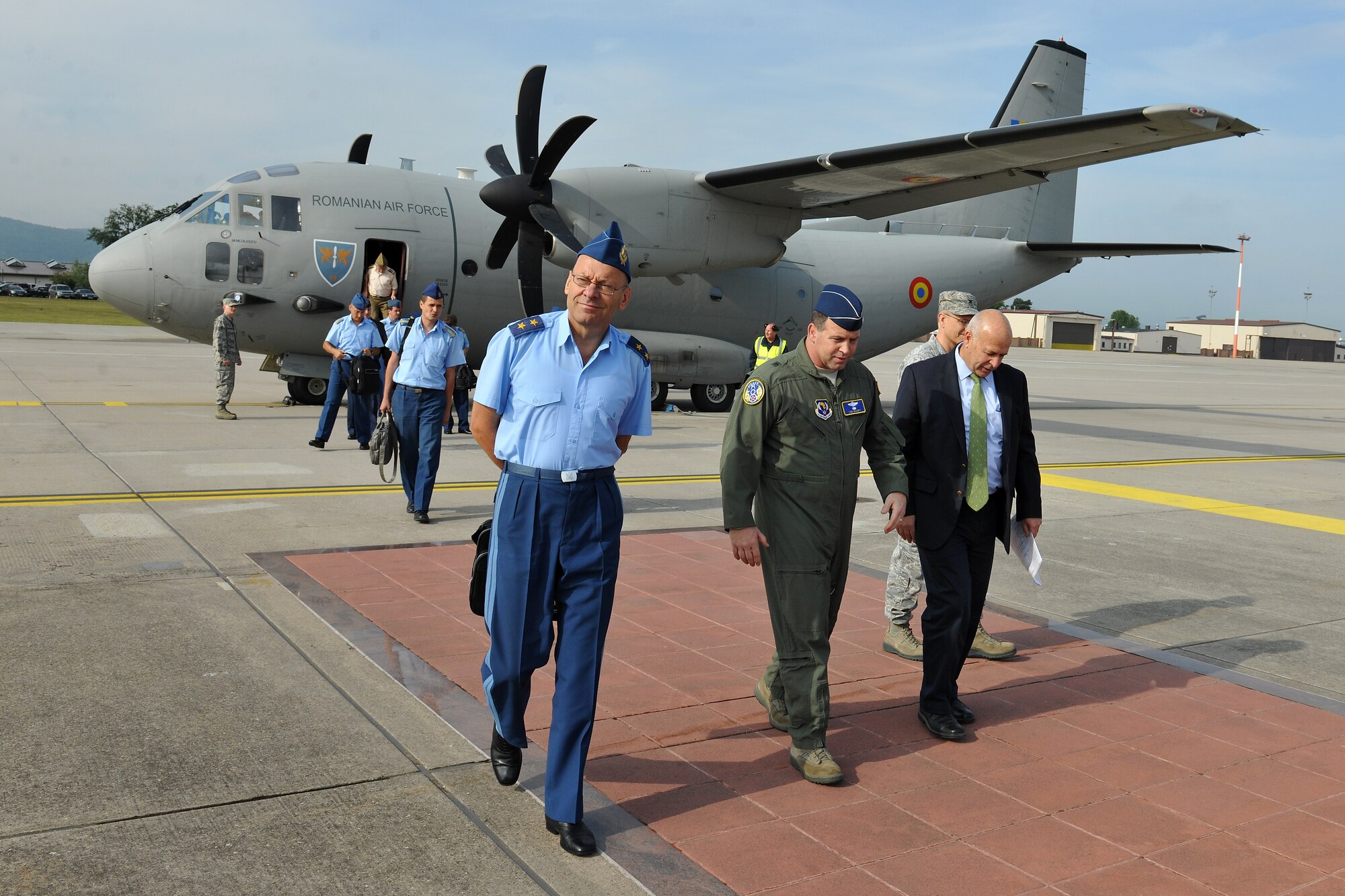 Brig. Gen. Thomas Sharpy, director of plans, programs and analyses for Headquarters U.S. Air Forces in Europe and Air Forces Africa, greets members of the Romanian air force, June 28, 2013, Ramstein Air Base Germany.  Members of the Romanian air force came here to meet with Airmen and exchange ideas for training and to continue to build upon the relationship between Romania and the U.S. Air Force. (U.S. Air Force photo/Senior Airman Chris Willis) 
