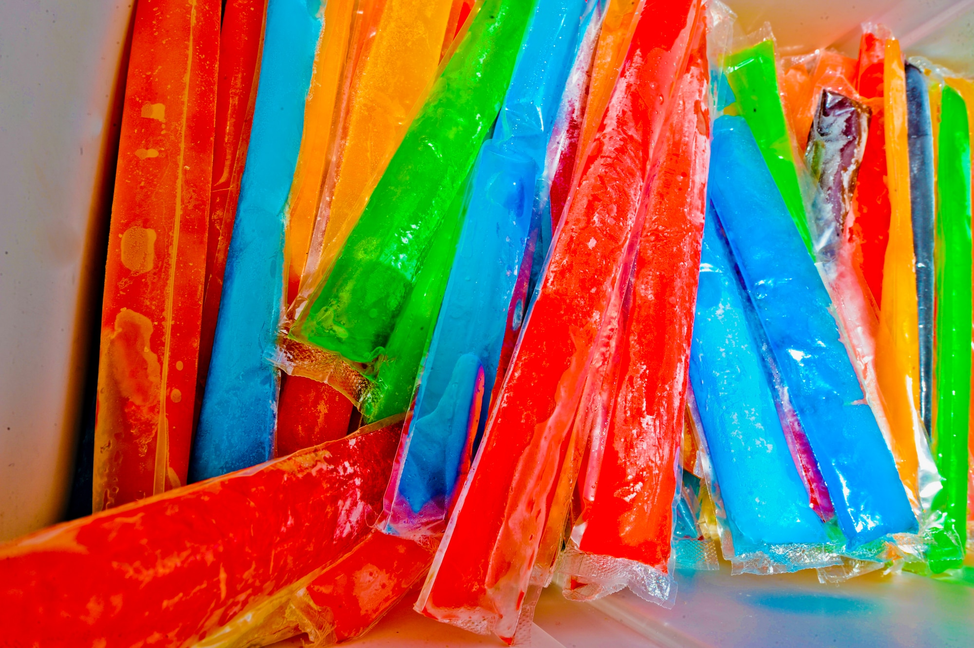 Bars of icy pops sit in a cooler waiting to be passed out to Airmen of the 380th Expeditionary Maintenance Group at an undisclosed location in Southwest Asia July 9, 2013. U.S. Air Force Chaplain (Capt.) Winston Jones, 380th Air Expeditionary Wing, uses the icy pops as a way to get out and meet and talk with Airmen on the flightline.  (U.S. Air Force photo by Staff Sgt. Joshua J. Garcia)
