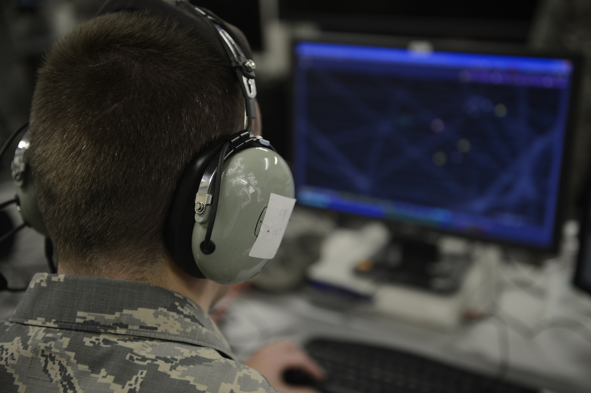 U.S. Air Force Capt. Craig Ansel, 606th Air Control Squadron assistant operations officer from Youngstown, N.Y., trains Airmen in managing airspace, July 1, 2013. The 606th ACS has deployed to Southwest Asia for several months to provide air defense of the Arabian Gulf. (U.S. Air Force photo by Staff Sgt. Christopher Ruano/Released)