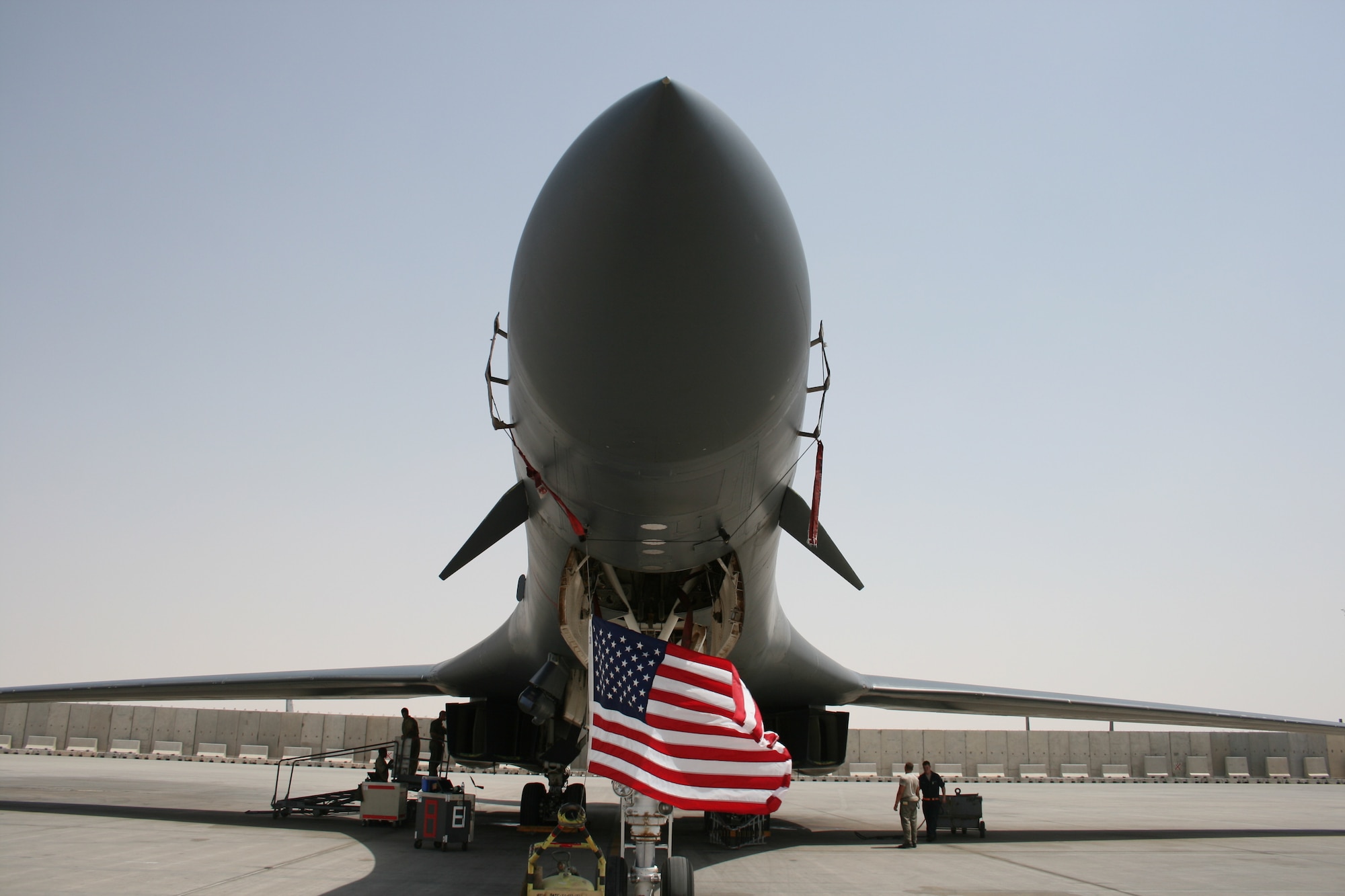 A 34th Expeditionary Bomb Squadron’s B-1B Lancer displays a flag in celebration of Independence Day at the 379th Air Expeditionary Wing in Southwest Asia, July 4, 2013. Carrying the largest payload of both guided and unguided weapons in the Air Force inventory, the multi-mission B-1 is the backbone of America's long-range bomber force. (U.S. Air Force photo/Master Sgt. Charles Bridges)