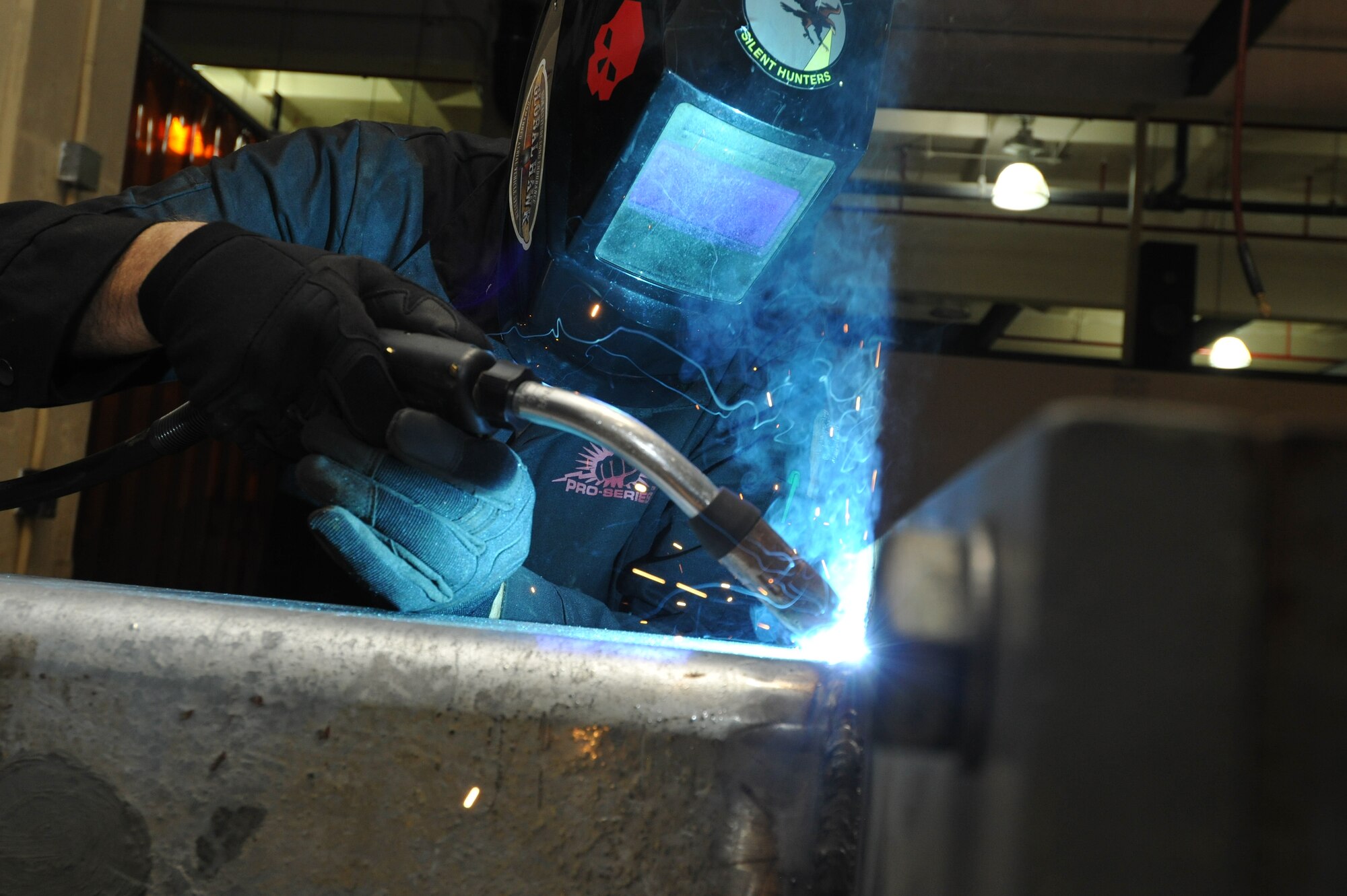 Staff Sgt. Jeremy Flint, 36th Maintenance Squadron Metals Technology Section NCO in charge, modifies a rotary launch adaptor proof load test stand for a B-52 Stratofortress July 9, 2013, on Andersen Air Force Base, Guam. The proof load test stand, which is the only stand in the Air Force, is used to test the structural integrity of the repaired RLAs. (U.S. Air Force photo by Senior Airman Robert Hicks/Released)