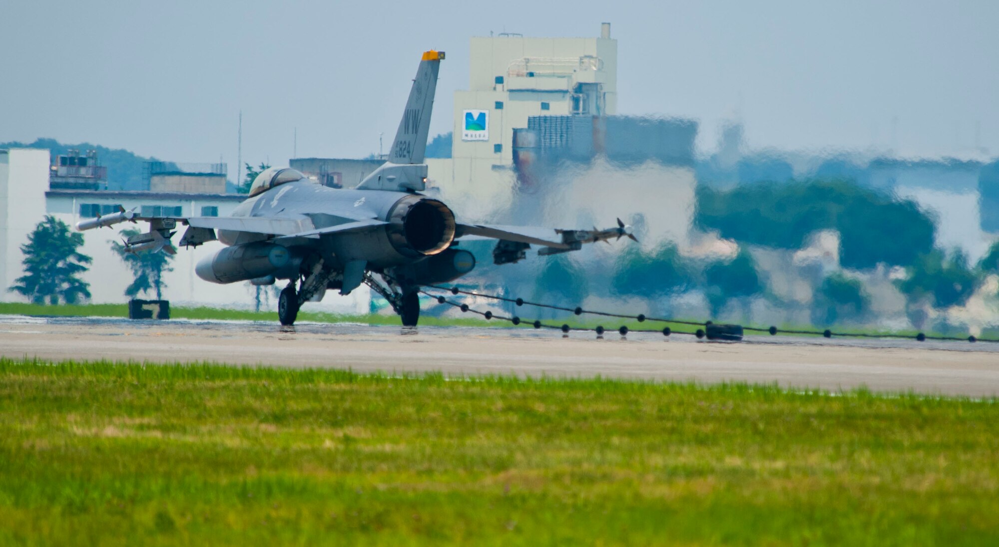 YOKOTA AIR BASE, Japan – An F-16 Fighting Falcon halts after hooking onto the arresting cable at Yokota Air Base, Japan, July 10, 2013.  Arresting gear is used to rapidly decelerate an aircraft during a landing with in-flight emergency situations.  Two F-16’s from Misawa Air Base, Japan, assisted with testing the system.  (U.S. Air Force photo by Airman 1st Class Soo C. Kim)