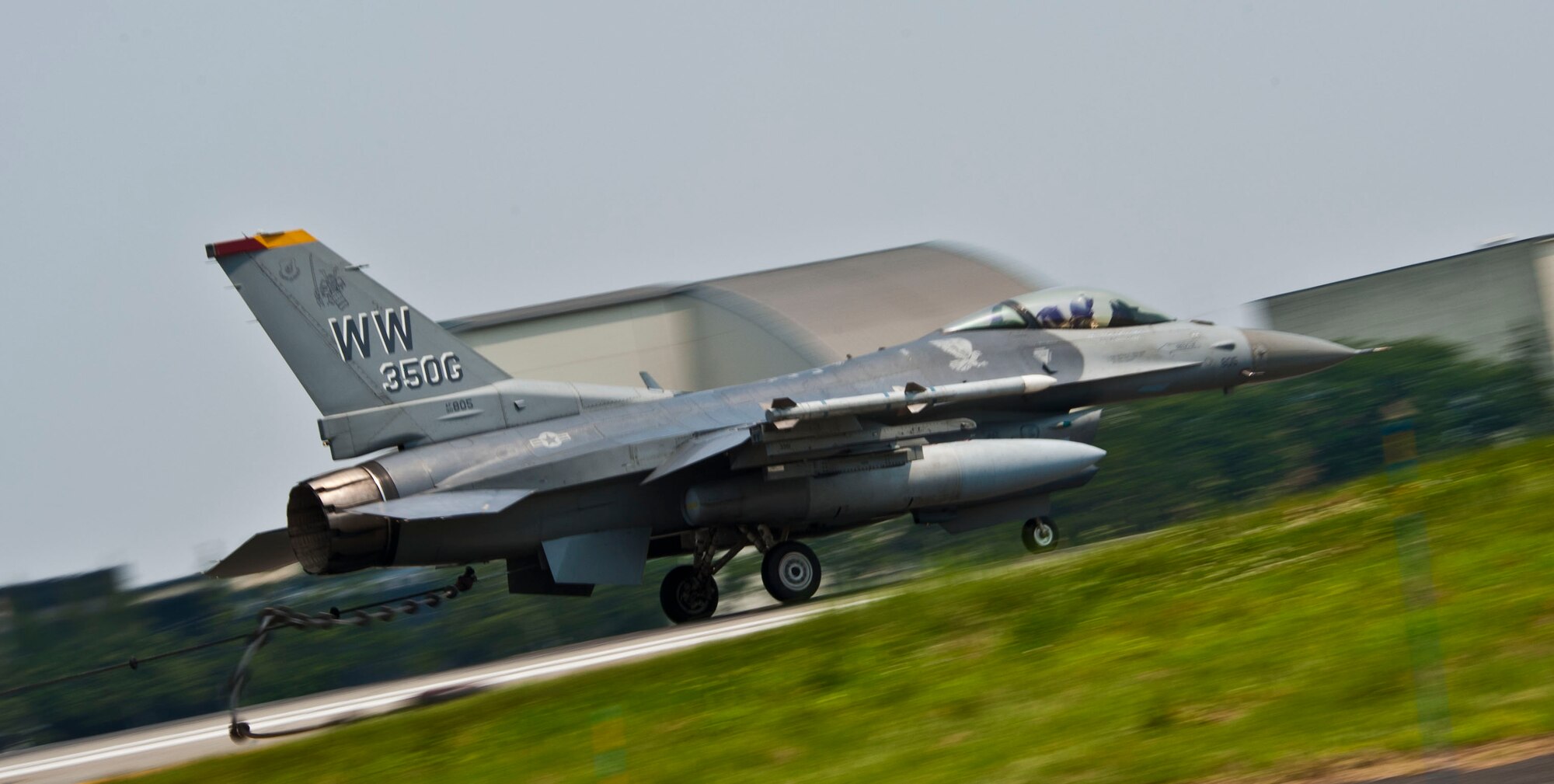 YOKOTA AIR BASE, Japan – An F-16 Fighting Falcon performs a high-speed taxi and hooks onto the arresting cable at Yokota Air Base, Japan, July 10, 2013.  The arresting gear is used to rapidly decelerate an aircraft during in-flight emergency landing, saving the life of pilot and the aircraft. Two F-16’s from Misawa Air Base, Japan, assisted with testing the system. (U.S. Air Force photo by Airman 1st Class Soo C. Kim)