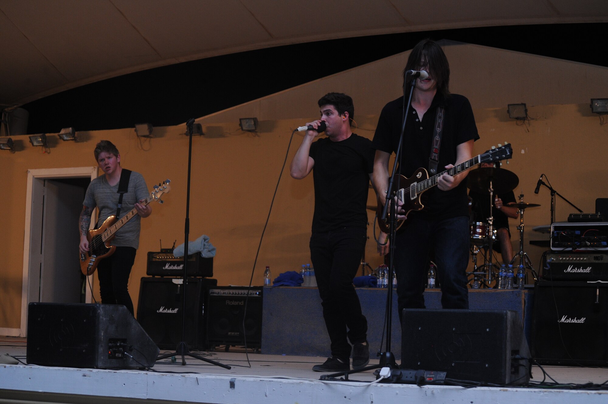 Alternative, pop-rock band, Transmit Now, performs during an Armed Forces Entertainment Tour across the region, July 7, 2013 at the 379th Air Expeditionary Wing in Southwest Asia. The Orlando, Fla., band staked their claim to fame after winning an online “Battle of the Bands” contest, resulting in their first live performance in 2008. (U.S. Air Force photo/ Senior Airman Bahja J. Jones)