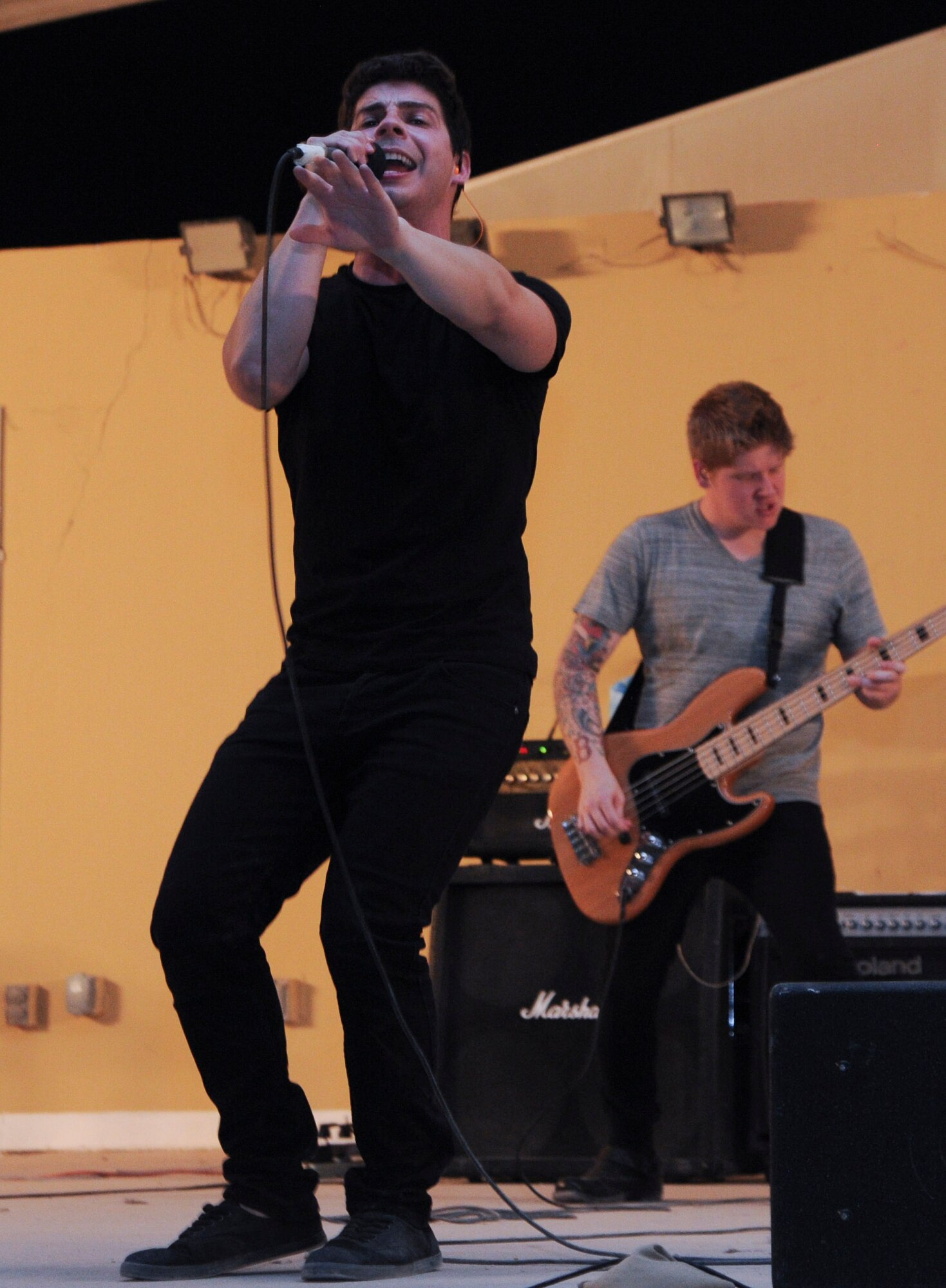 Members of Transmit Now perform during an Armed Forces Entertainment Tour across the region, July 7, 2013 at the 379th Air Expeditionary Wing in Southwest Asia. AFE is the official Department of Defense agency for providing entertainment to U.S. military personnel overseas. (U.S. Air Force photo/ Senior Airman Bahja J. Jones) 