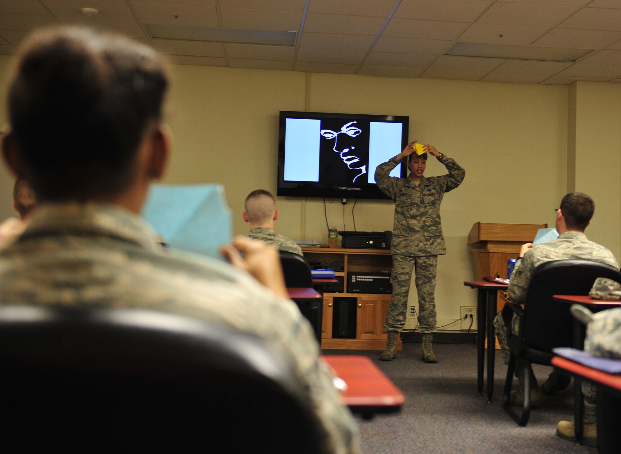 U.S. Air Force Master Sgt. Tanya Wyatt, 18th Wing Equal Opportunity advisor, conducts a exercise in communcation on Kadena Air Base, Japan, May 21, 2013. Wyatt not only promotes an environment free from personal, social or institutional barriers, but a positive atmosphere wherever she goes. (U.S. Air Force photo by Staff Sgt. Rachelle Coleman/Released)