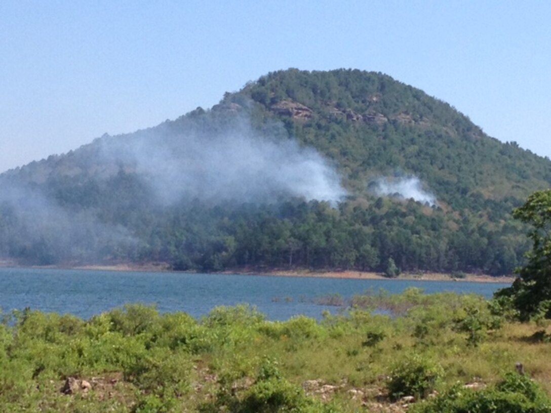Heber Springs, Ark. – The Army Corps of Engineers, Greers Ferry Project Office wants its neighbors and visitors to know that because of a lightning strike on July 10 Sugar Loaf Mountain has a fire burning on it.
  
Visitors are asked to not hike the mountain as long as an active fire is present.
