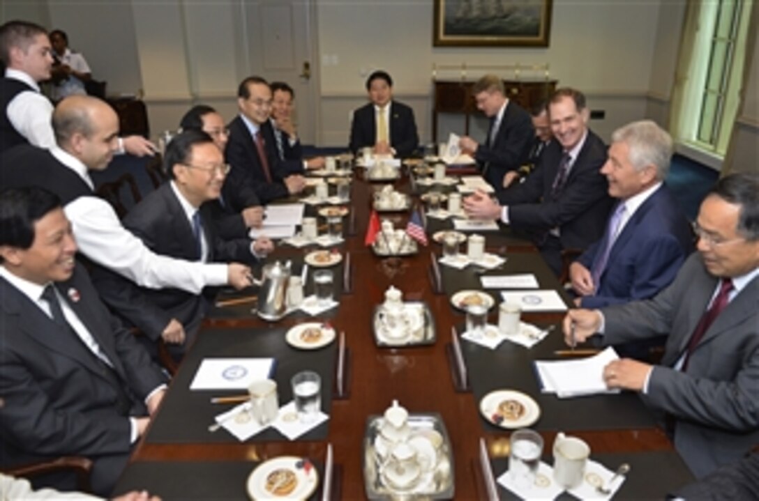 Secretary of Defense Chuck Hagel, second from right, hosts a meeting with Chinese State Councilor Yang Jiechi, third from right, in the Pentagon in Arlington, Va., on July 12, 2013.  Hagel and Yang have a shared history and friendship that stretches back many years to their previous positions in government service.  