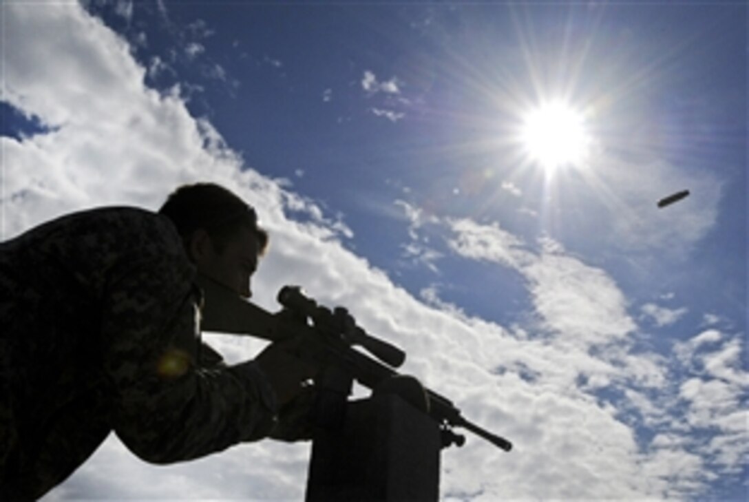 Army Spc. Kjirk Dixon fires during the final day of qualifications for the M110 semi-automatic sniper system on Joint Base Elmendorf-Richardson's Grezelka Range, Alaska, July 10, 2013. Dixon is assigned to the 25th Infantry Division's Company A, 1st Battalion, 501st Infantry Regiment, 4th Brigade Combat Team. The brigade's soldiers are attending the U.S. Army Mobile Sniper School, a five-week course with graded marksmanship on several sniper systems.