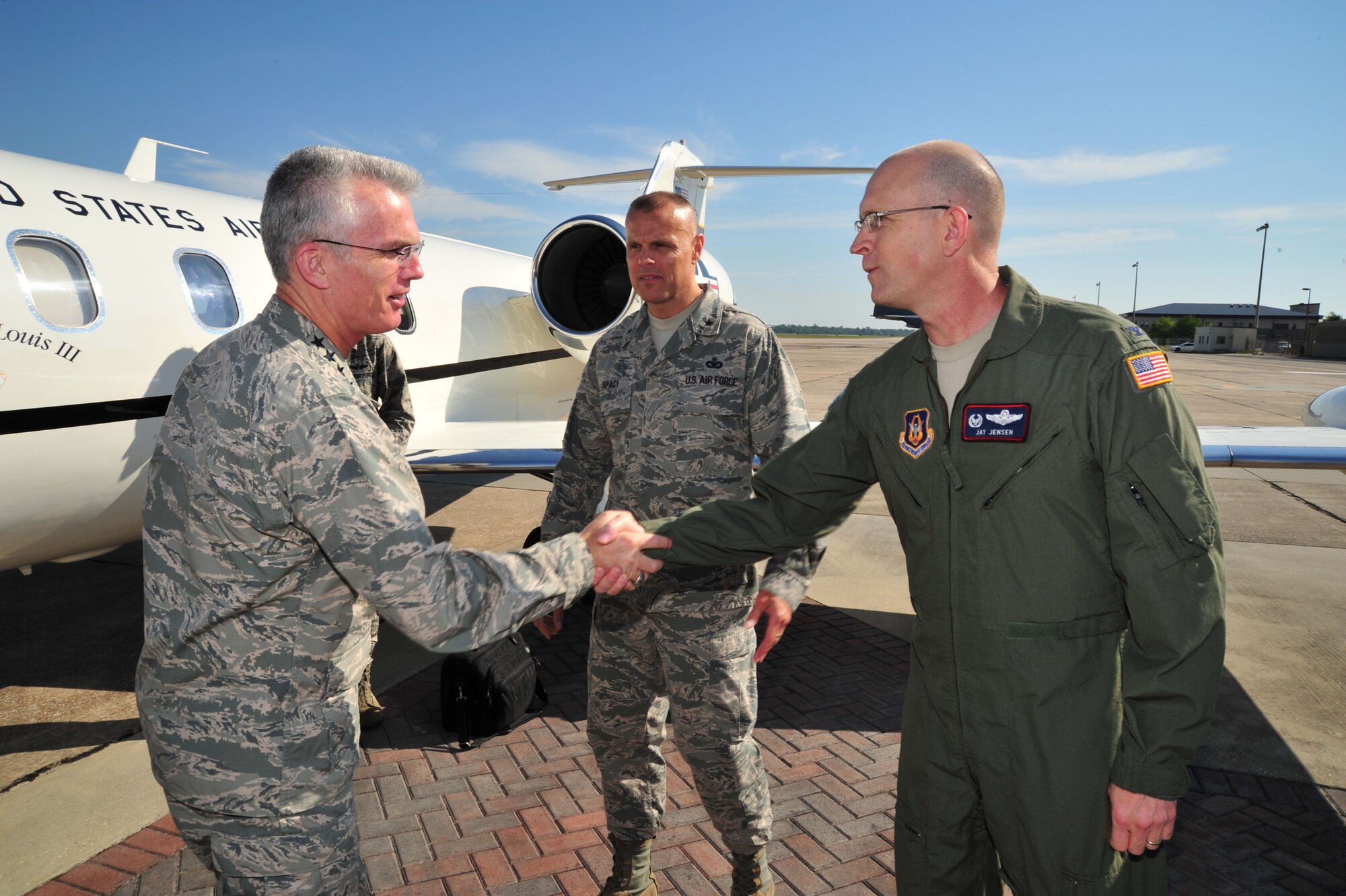 Gen. Paul Selva, commander of Air Mobility Command, is greeted by 403rd Wing commander Jay Jensen after arriving at Keesler Air Force Base, Miss., May 15, 2013. During his visit, the general toured the 815th and 345th Airlift Squadrons and the 53rd Weather Reconnaissance Squadron, all units under the 403rd Wing, as well as the 81st Training Wing. (U.S. Air Force photo/Tech. Sgt. Ryan Labadens)
