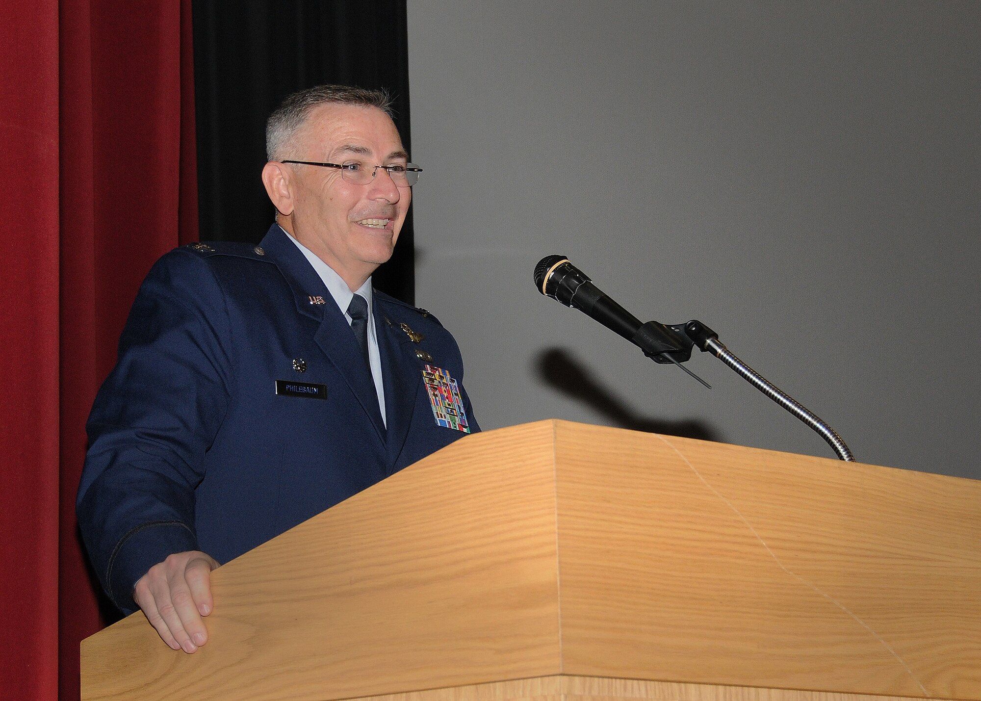 Col. Jonathan M. Philebaum, 512th Operations Group commander, addresses Liberty Wing Airmen during his assumption of command ceremony held at the base theater, Dover Air Force Base, Del., July 13, 2013. He will be overseeing the reserve flying operations and worldwide employment of the C-5M Super Galaxy and C-17A Globemaster III. (U.S. Air Force photo/Senior Airman Erika Brooke)