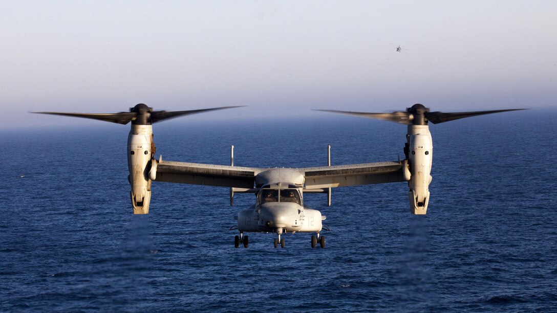 A U.S. Marine Corps MV-22B Osprey assigned to Marine Medium Tiltrotor Squadron (VMM) 266 (Reinforced), 26th Marine Expeditionary Unit (MEU), lands on the flight deck of the USS Kearsarge (LHD 3), at sea, July 13, 2013.  The 26th MEU is a Marine Air-Ground Task Force forward-deployed to the U.S. 5th Fleet area of responsibility aboard the Kearsarge Amphibious Ready Group serving as a sea-based, expeditionary crisis response force capable of conducting amphibious operations across the full  range of military operations. (U.S. Marine Corps photo by Sgt. Christopher Q. Stone/Released)