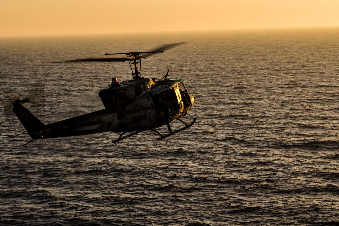 A UH-1N Huey assigned to Marine Medium Tiltrotor Squadron (VMM) 266 (Reinforced), 26th Marine Expeditionary Unit (MEU), prepares to land on the flight deck of the USS Kearsarge (LHD 3) after conducting flight operations, at sea, July 14, 2013.  The 26th MEU is a Marine Air-Ground Task Force forward-deployed to the U.S. 5th Fleet area of responsibility aboard the Kearsarge Amphibious Ready Group serving as a sea-based, expeditionary crisis response force capable of conducting amphibious operations across the full  range of military operations. (U.S. Marine Corps photo by Cpl. Kyle N. Runnels/Released)