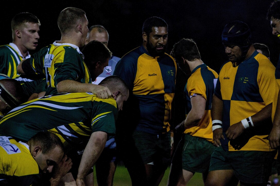 Marines and Sailors (left) of the 31st Marine Expeditionary Unit and crew of the USS Bonhomme Richard prepare to engage in a scrum with players of the Brisbane West Bulldogs (right) during a rugby match here, July 12. The match was orchestrated weeks prior to the units’ arrival in Australia, as a way for the service members to embrace some of the culture and build camaraderie. Over the next few weeks, the Marines and Sailors of the 31st MEU and the Amphibious Squadron 11 will conduct integrated training with their Australian counterparts in order to improve their cooperative ability to plan, communicate and conduct complex operations. 