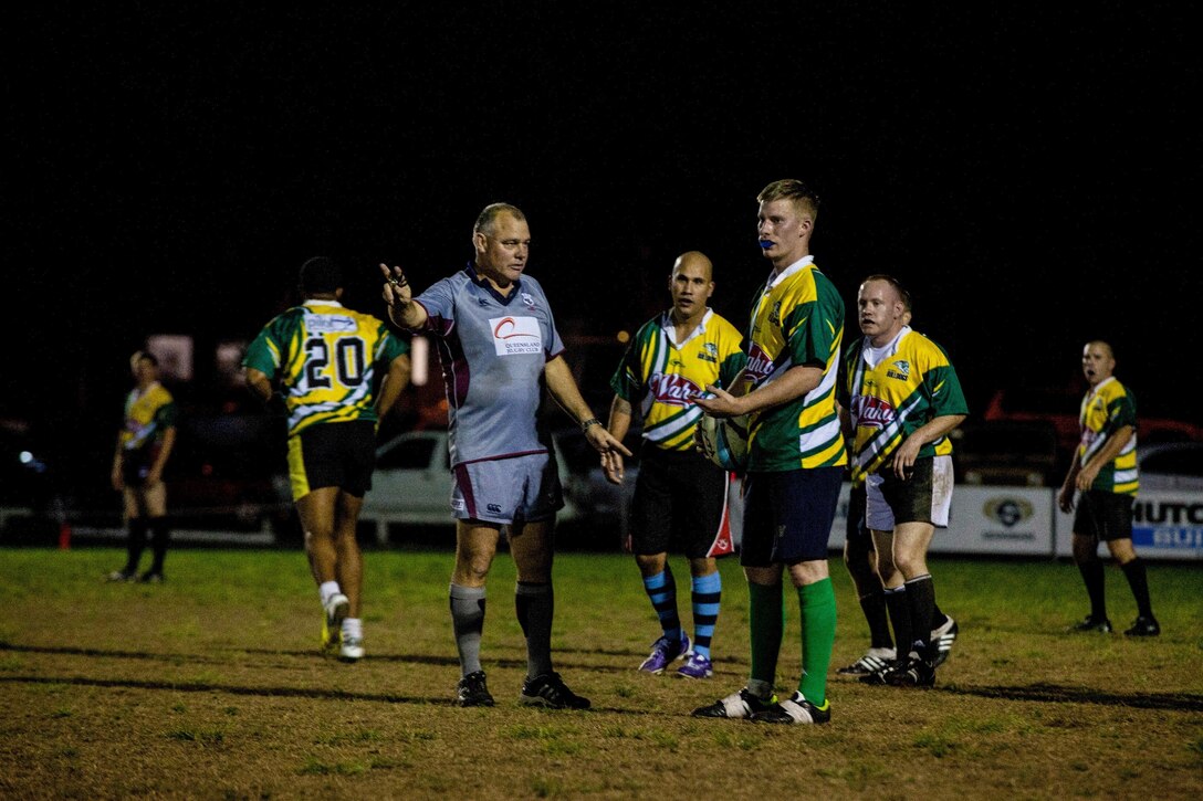 Marines and Sailors of the 31st Marine Expeditionary Unit and crew of the USS Bonhomme Richard prepare to kick off to players of the Brisbane West Bulldogs during a rugby match here, July 12. The match was orchestrated weeks prior to the units’ arrival in Australia, as a way for the service members to embrace some of the culture and build camaraderie. Over the next few weeks, the Marines and Sailors of the 31st MEU and the Amphibious Squadron 11 will conduct integrated training with their Australian counterparts in order to improve their cooperative ability to plan, communicate and conduct complex operations.