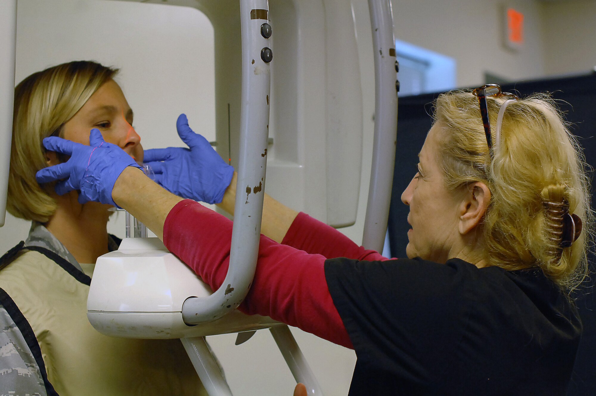 Capt. Bobbie Young, 403rd Wing executive officer, receives a panoramic X-ray from Linda Rey, pano assistant, at the on-site dental clinic held in the 403rd Aeromedical Staging Squadron July 13, 2013.  The dental clinic took place to ensure deployment readiness of 403rd Wing members (U.S. Air Force photo/Tech. Sgt. Jessica L. Kendziorek).
