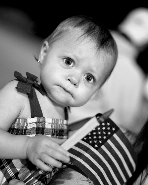 Taylor McCoy, 13 months, waits patiently for her father, Staff Sgt. Dennis McCoy, to return from a two-month deployment. McCoy, a weapons loader, with about 200 other 180th Fighter Wing Airmen returned from an Air Expeditionary Force deployment lasting for just over two months. The 180th FW initially deployed to Djibouti, Africa in support of the Combined Joint Task Force-Horn of Africa (CJTF-HOA) to conduct stability operations in the area. At the end of June, members of the AEF were forward deployed to Muwaffaq Sulti AF, Azraq, Jordan, as part of Exercise Eager Lion. Eager Lion is a recurring, multinational exercise designed to strengthen military to military relationships and enhances regional security and stability by responding to modern day scenarios. Air National Guard Photo by Mast er Sgt. Beth Holliker (Released).