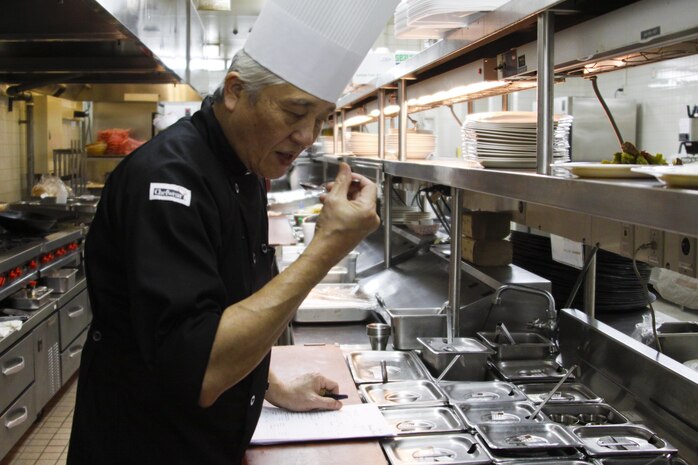Seiji Shoya, Club Iwakuni supervisor, performs a taste test at Club Iwakuni at Marine Corps Air Station Iwakuni, Japan, June 27, 2013. Shoya has been working at Club Iwakuni for 32 years and is capable of doing any task in the kitchen.