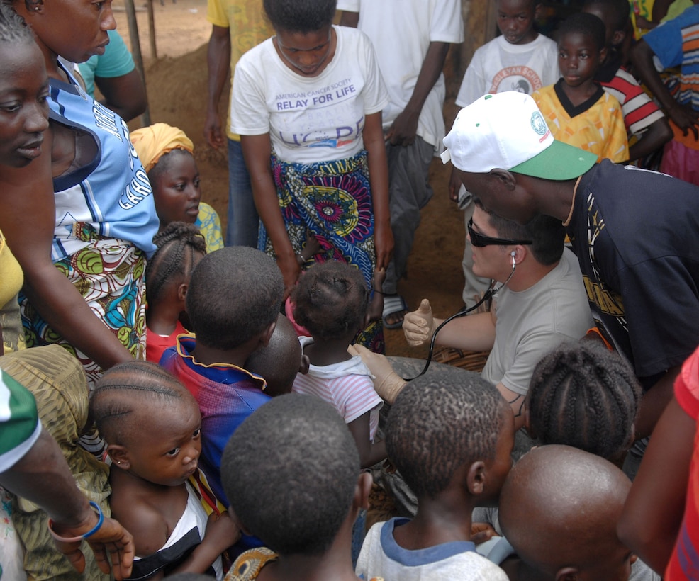 U.S. Army Staff Sgt. Derek Smith, Armed Forces of Liberia (AFL) personnel mentor deployed with Operation ONWARD LIBERTY (OOL) from Ft. Custer, Mich., discusses a child’s background with her mother during a medical outreach visit to Gondor Town, Liberia, July 2, 2013. The AFL led a 14-person medical outreach team including doctors, nurses and a support staff to three villages deep in the jungles of Grand Cape Mount County, Liberia, from July 1 to July 4, 2013. The medical outreach mission was a first for the AFL which was restructured in 2005 following 15 years of civil war. OOL advisers have been mentoring the AFL since 2010. OOL provides mentorship to the AFL to produce a capable, respected force able to protect Liberian interests in the West African region. In addition, the OOL is developing the leadership capabilities of the officers and noncommissioned officers to maintain a professional and credible military force with a reputation as a “force for good” among the Liberian people.