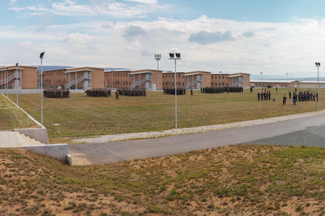 U.S. Marines and sailors with Black Sea Rotational Force 13, along with Bulgarian, Serbian and Romanian forces, stand in formation at Novo Selo, Bulgaria, during an opening ceremony July, 1, 2013. The opening ceremony marked the beginning of Platinum Lion 13, BSRF-13’s five week exercise in Bulgaria. The exercise allows the U.S. and Balkan military forces to practice stability, counterinsurgency, and peacekeeping operations in order to build partner nation capacity, enhance interoperability between countries and increase the overall effectiveness of the participating partnered nations. (U.S. Marine Corps photo illustration by 1st Lt. Hector Alejandro)