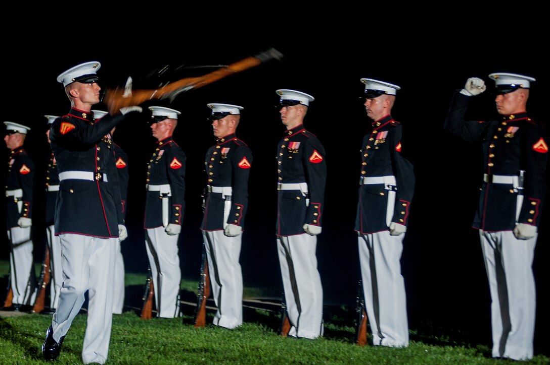 Cpl. Sean Breheny, Marine Corps Silent Drill Platoon rifle inspector, performs during a Friday Evening Parade at Marine Barracks Washington, D.C., July 12. (Official Marine Corps photo by Lance Cpl. Dan Hosack/Released) 